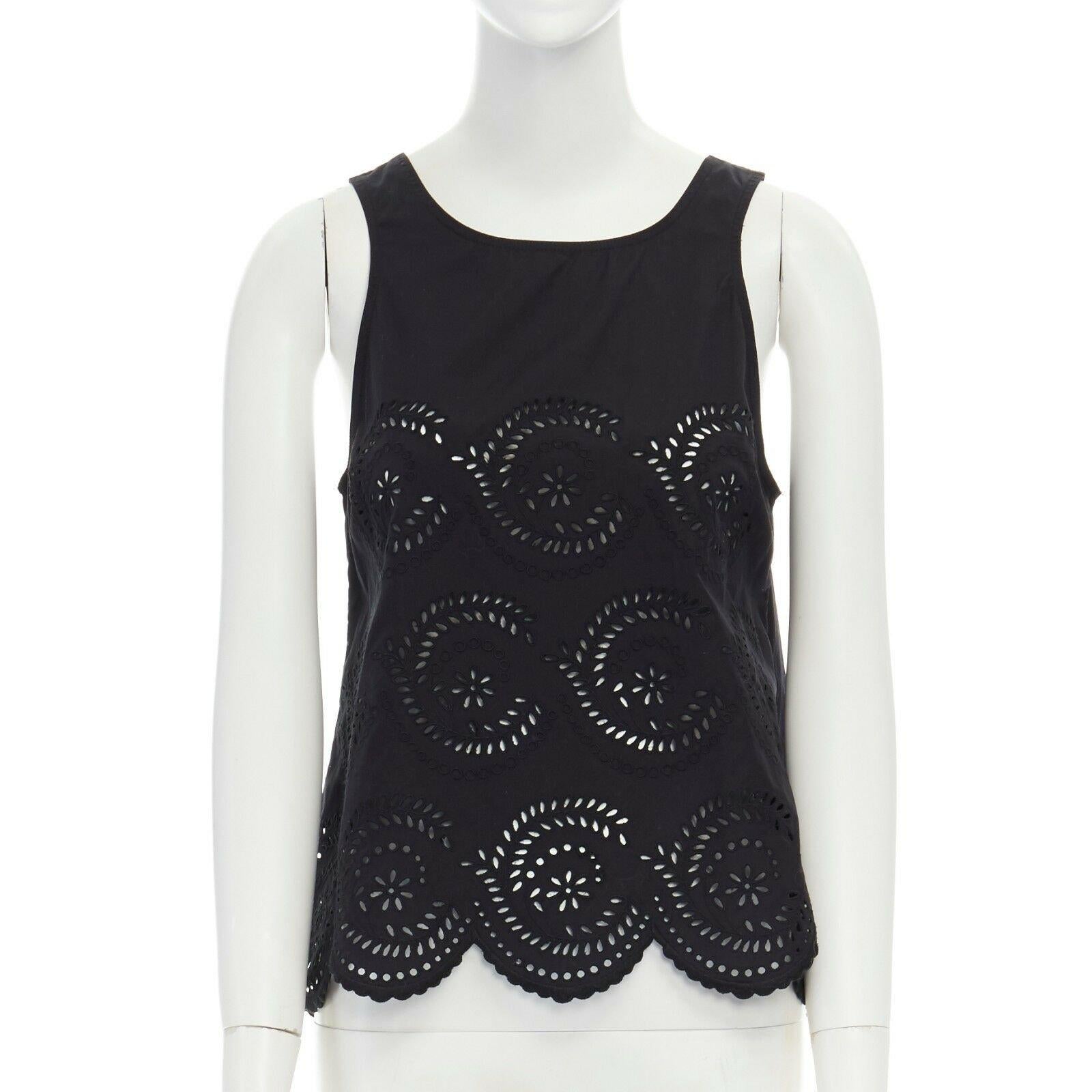 MARC BY MARC JACOBS black cotton embroidery angais scalloped  sleeveless top XS
Brand: Marc by Marc Jacobs
Designer: Marc Jacobs
Model Name / Style: Cotton vest
Material: Cotton
Color: Black
Pattern: Solid
Closure: Button
Extra Detail: Keyhole back