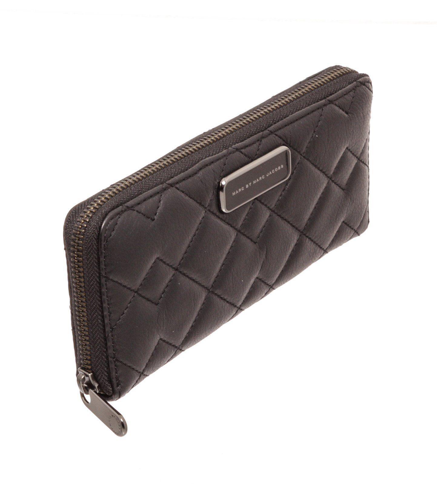 Marc By Marc Jacobs black quilted leather long zippy wallet with silver-tone hardware, logo placard at front face, black leather interior lining, five interior compartments; one with zip closure, twelve card slots and overall zip around