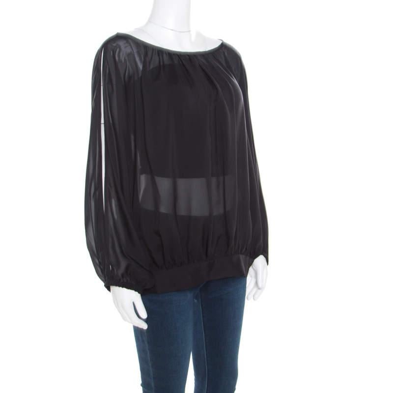 This Marc by Marc Jacobs blouse can be paired with almost everything in your wardrobe. This black piece would make you the center of attention of any event in seconds. Tailored from silk, this blouse would keep you at the top of the style game.

