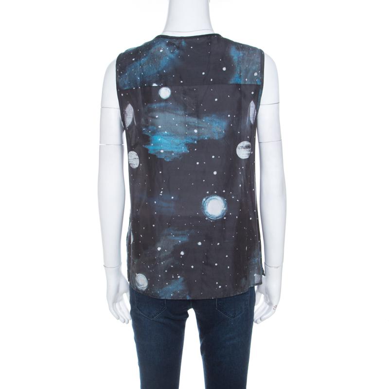 This top from Marc by Marc Jacobs is made from cotton and silk. It comes in black with Stargazer prints all over, and detailing of ruffles and buttons on the front. The sleeveless top is simple and comfortable to wear.

Includes: The Luxury Closet