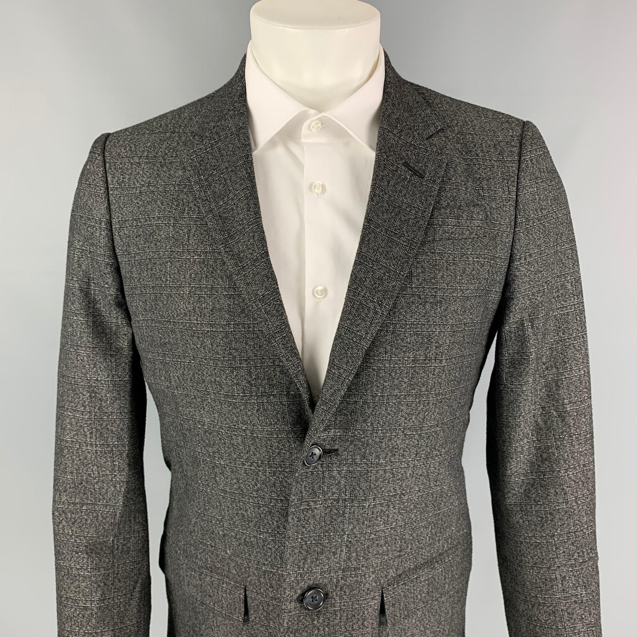 MARC by MARC JACOBS sport coat comes in a charcoal heather wool blend with a full liner featuring a notch lapel, flap pockets, and a double button closure.
Very Good
Pre-Owned Condition. 

Marked:   M 

Measurements: 
 
Shoulder: 17 inches Chest: 38