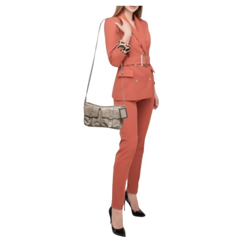 This Marc by Marc Jacobs bag for women beautifully shows quality craftsmanship. The interior of this super-practical bag is lined with fabric, secured by a flap, and the shoulder strap attached allows for crossbody wear.