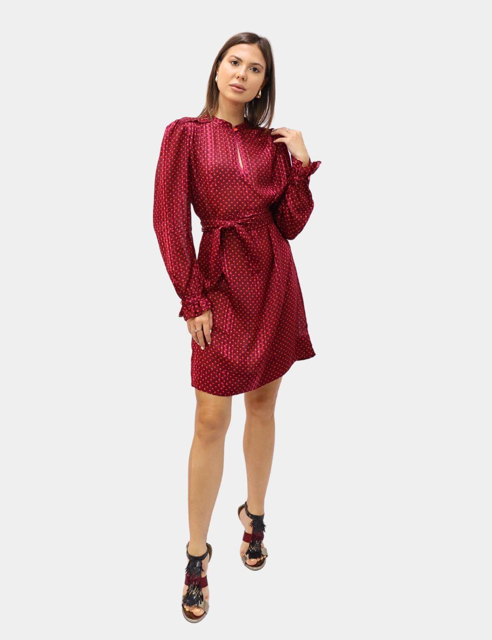 Playful yet polished, this Marc by Marc Jacobs Red Polka Dot Dress is a versatile piece for day-to-night dressing. Crafted from silky satin fabric with a subtle sheen, this mini dress features a charming red and black polka dot print, long sleeves