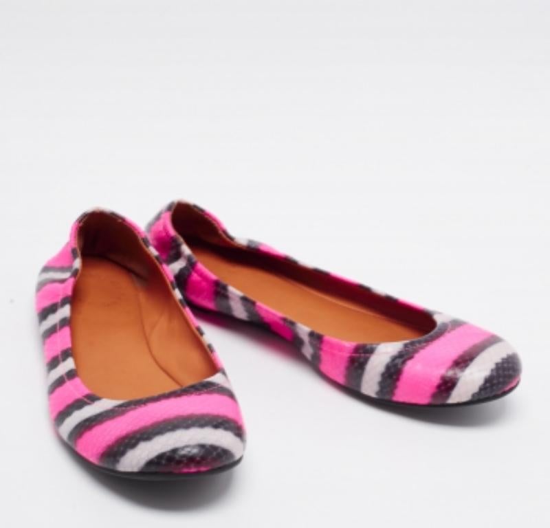 Created from watersnake embossed leather, these Marc by Marc Jacobs flats will ensure comfortable and colorful steps.  The design is made practical with a slip-on fitting and rubber soles.