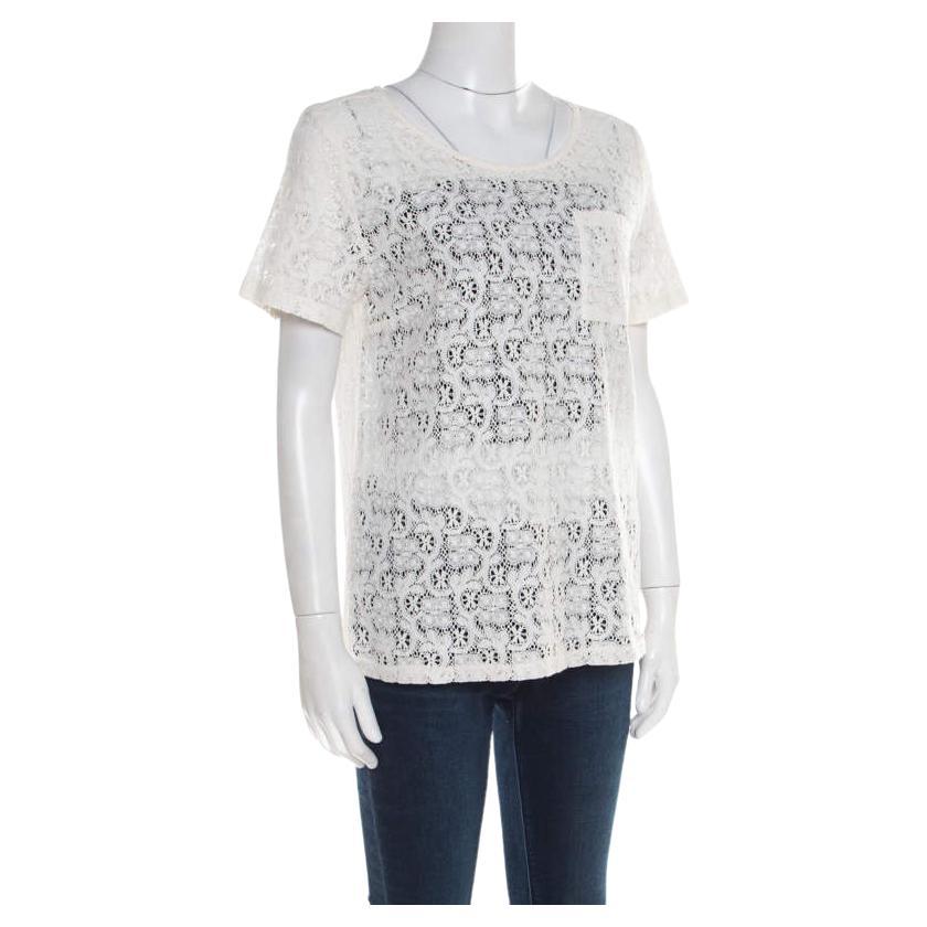 This white top from Marc by Marc Jacobs is such a stunner. The top is made of a cotton blend and features a beautiful floral lace textured pattern all over it. It flaunts a round neckline, short sleeves and a zip closure at the back.

