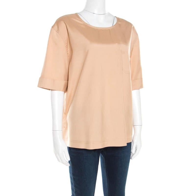 This top from Marc by Marc Jacobs is sure to go beyond your expectations. Just try this beige beauty and watch everyone give you all the attention at any event. Tailored from cotton, you would never regret purchasing this beautiful piece.

