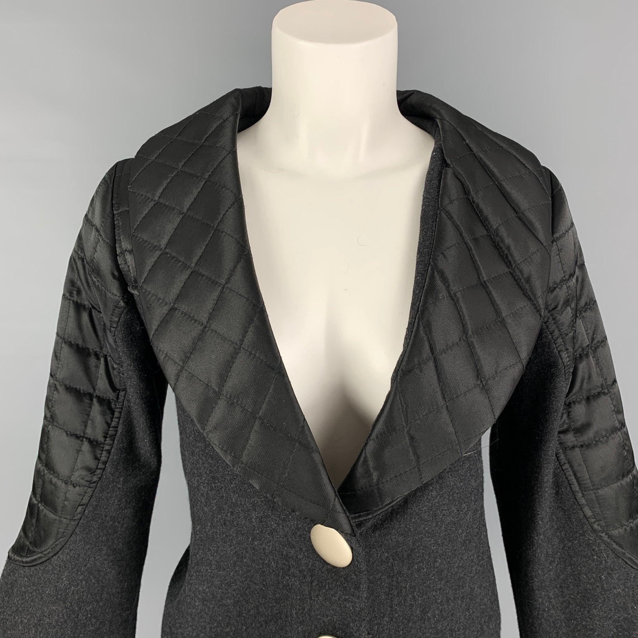 MARC by MARC JACOBS jacket comes in a grey wool with a full liner featuring black quilted panels, shawl collar, and a two button closure.
Very Good
Pre-Owned Condition. 

Marked:   2 

Measurements: 
 
Shoulder: 15 inches  Bust: 34 inches 