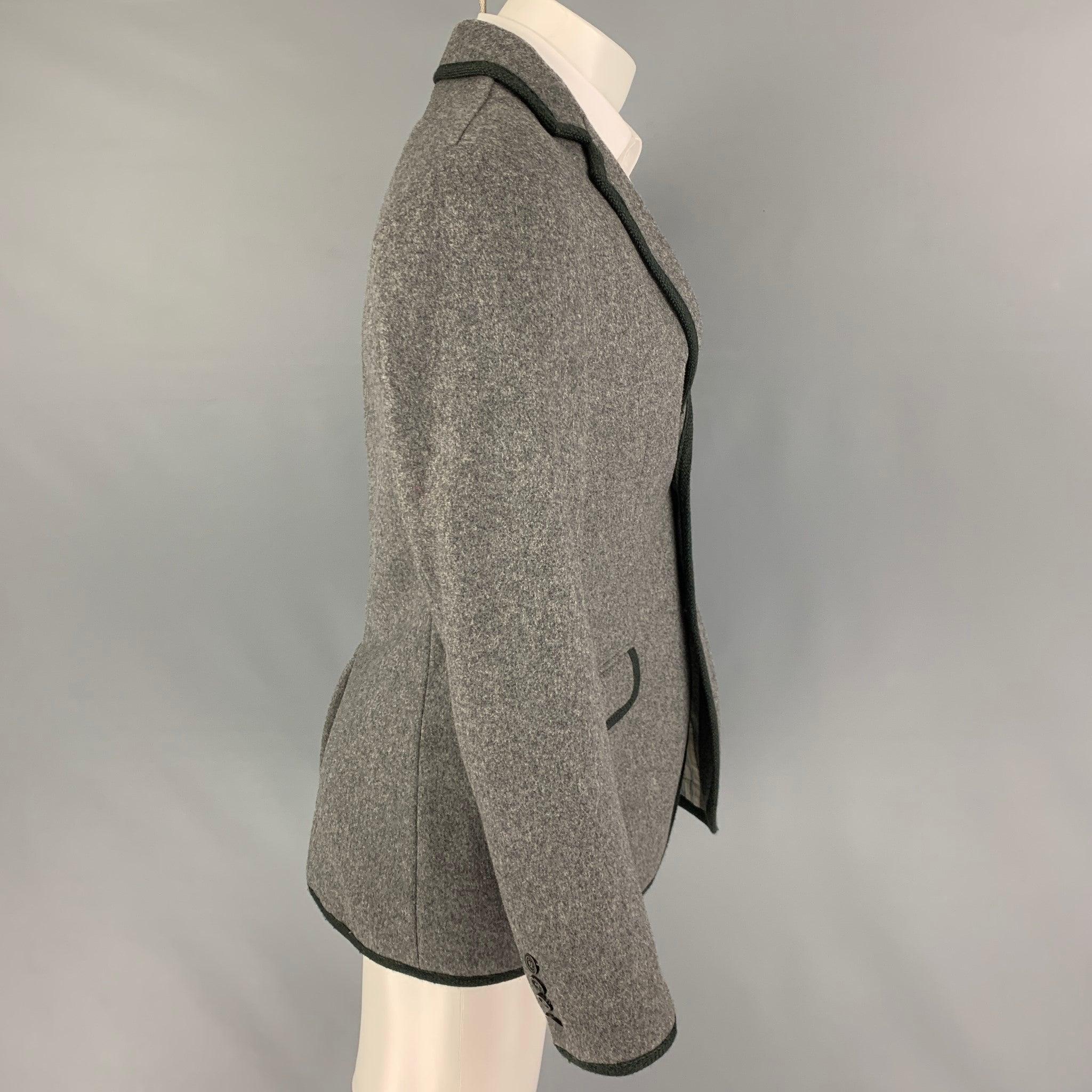 MARC by MARC JACOBS
sport coat comes in a gray wool / nylon with a charcoal trim featuring a notch lapel, flap pockets, single back vent, and a double button closure.Very Good Pre-Owned Condition.  

Marked:   S 

Measurements: 
 
Shoulder: 17.5