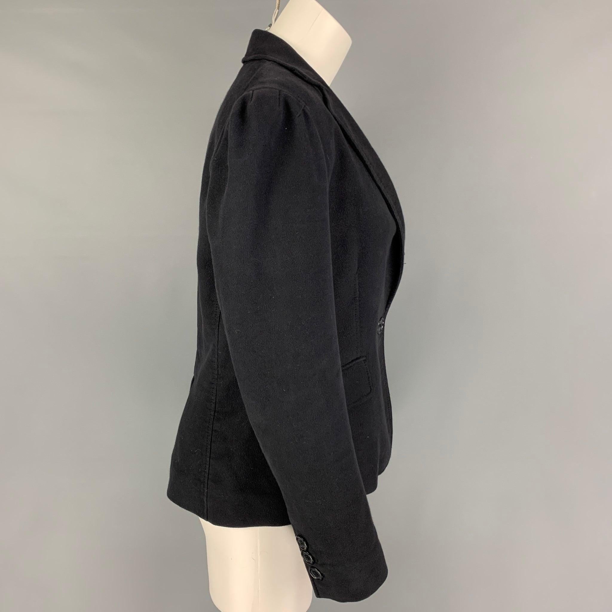 MARC by MARC JACOBS blazer comes in a charcoal cotton featuring a notch lapel, flap pockets, single back vent, and a single button closure.
Good
Pre-Owned Condition. 

Marked:   8 

Measurements: 
 
Shoulder: 16 inches Bust: 34 inches Sleeve: 24