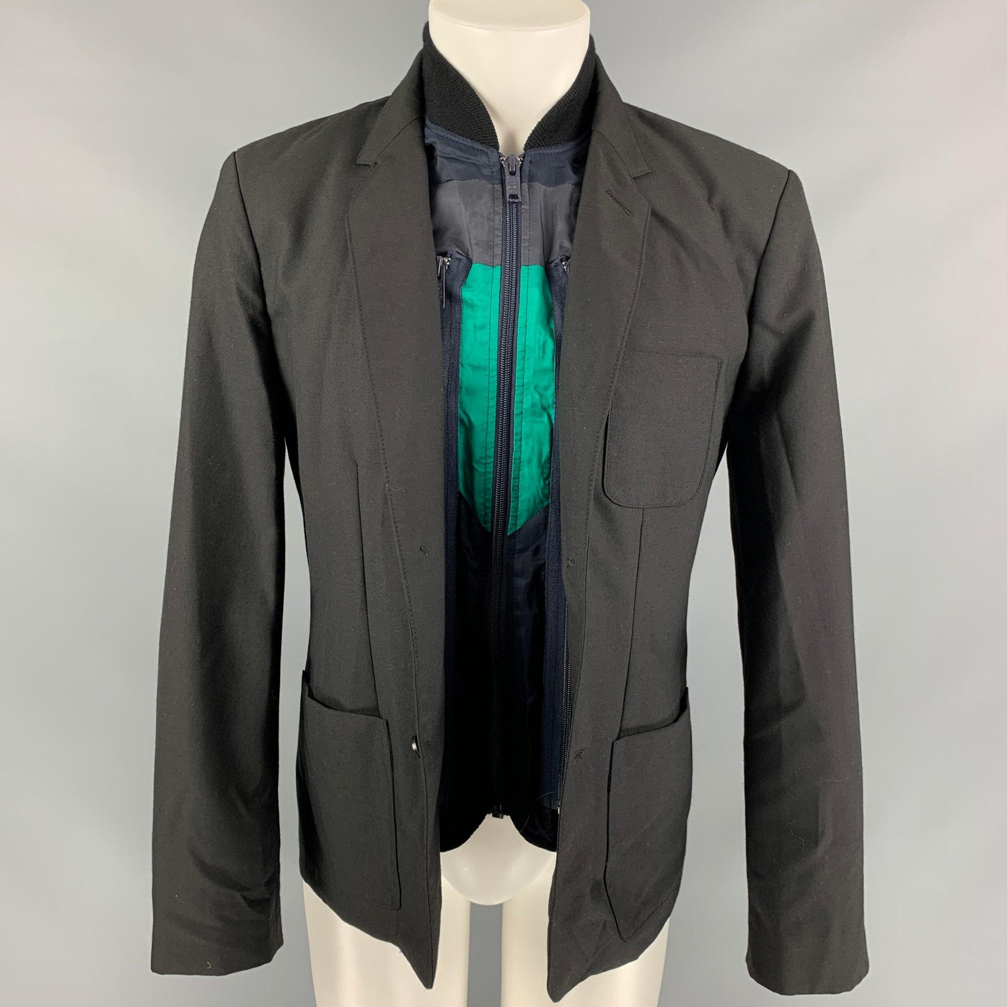 MARC by MARC JACOBS jacket comes in a black & navy polyester blend featuring a removable vest design, patch pockets, notch lapel, and a three button closure.
Very Good
Pre-Owned Condition.  

Marked:   L 

Measurements: 
 
Shoulder: 18 inches 
