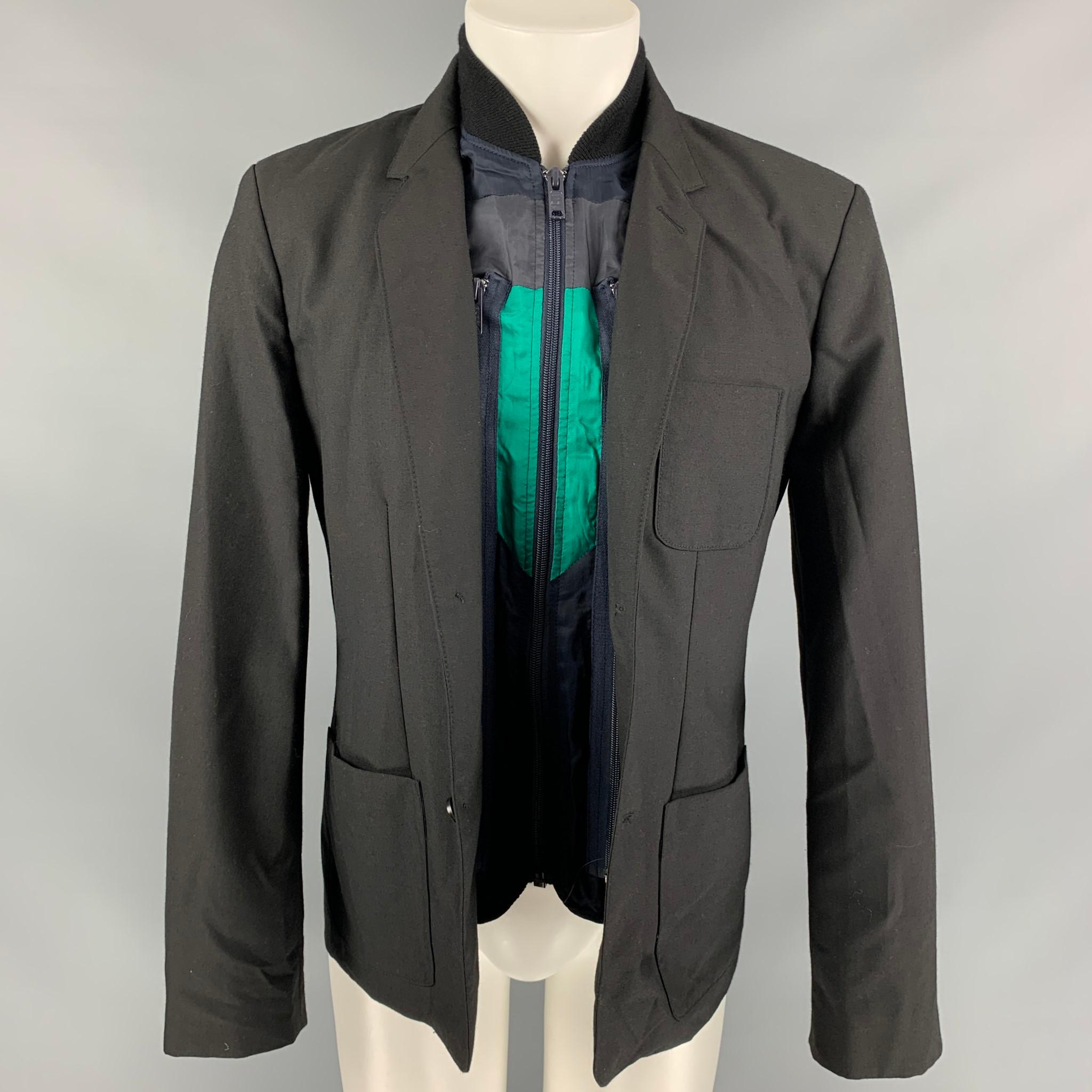 MARC by MARC JACOBS jacket comes in a black & navy polyester blend featuring a removable vest design, patch pockets, notch lapel, and a three button closure. 

Very Good Pre-Owned Condition.
Marked: L

Measurements:

Shoulder: 18 in.
Chest: 41