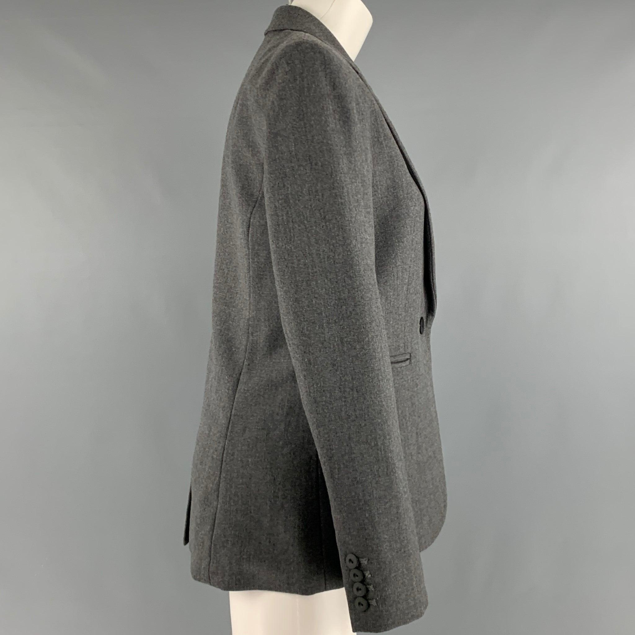 MARC by MARC JACOBS blazer
in a heather grey fabric with full liner featuring notch lapel, and single button closure. Made in USA.Excellent Pre-Owned Condition. 

Marked:   S 

Measurements: 
 
Shoulder: 16 inches Bust: 36 inches Sleeve: 24.5 inches