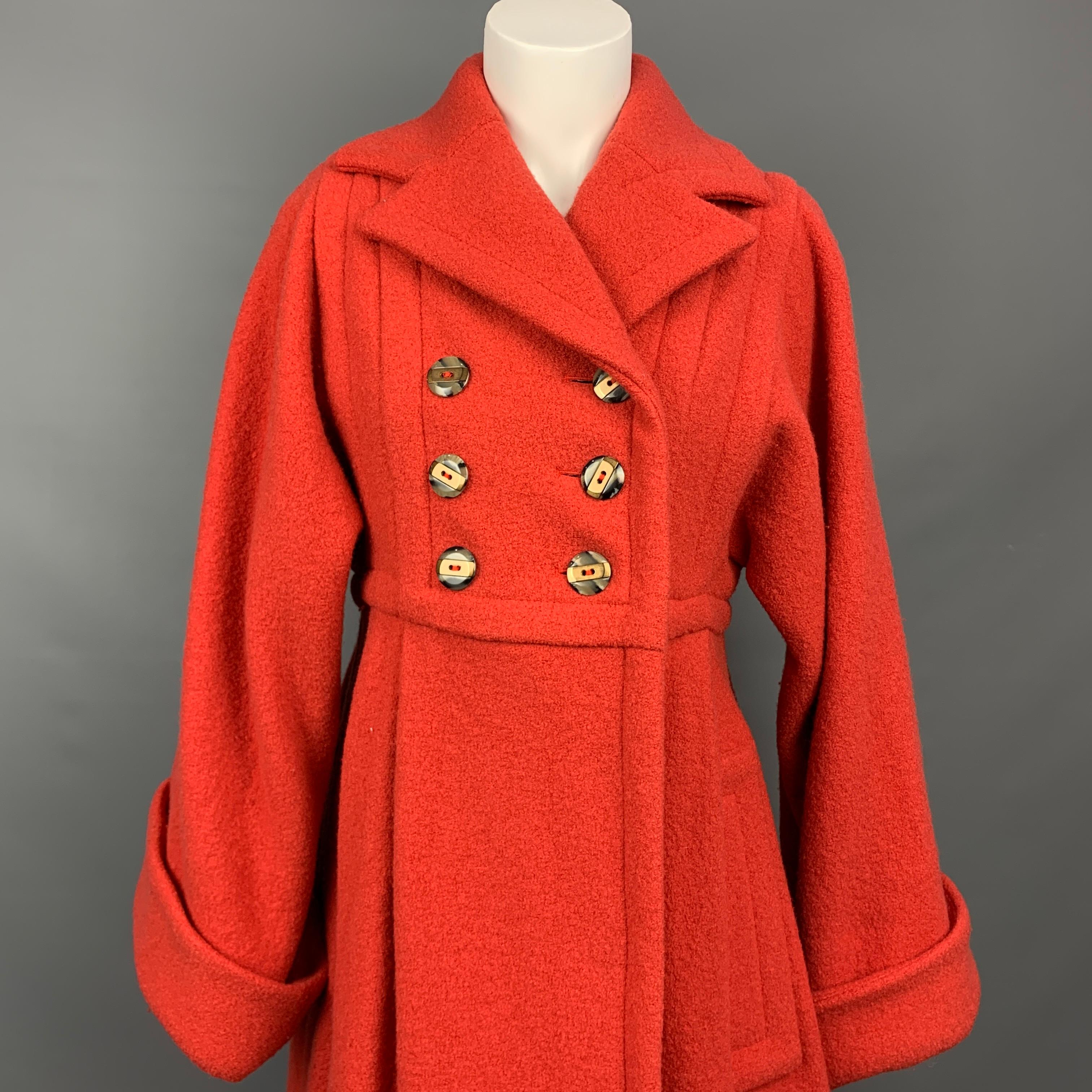 MARC by MARC JACOBS coat comes in a orange wool featuring a notch lapel, slit pockets, wide sleeves, and a double breasted closure. 

Very Good Pre-Owned Condition.
Marked: S

Measurements:

Shoulder: 14 in.
Bust: 36 in.
Sleeve: 28 in.
Length: 40
