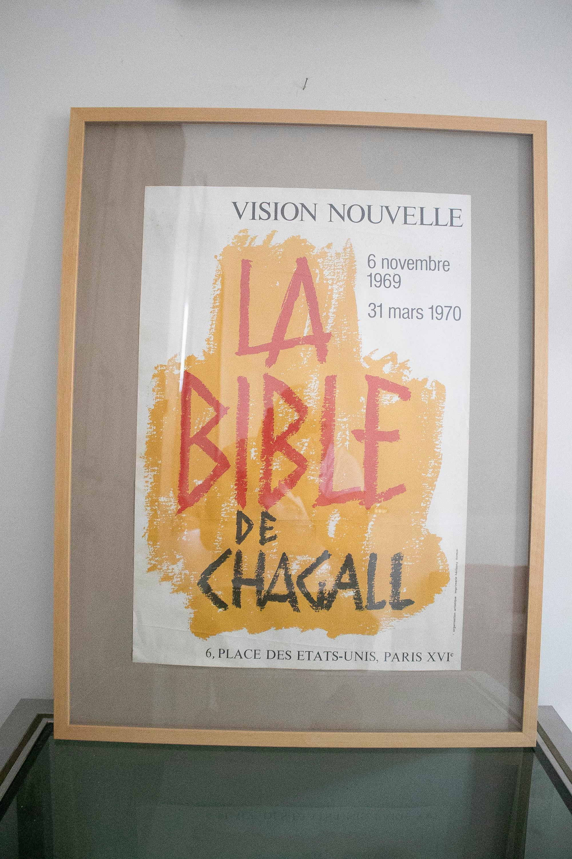 Framed exhibition poster of Russian born French modernist artist Marc Chagall, who was commissioned in 1931 to illustrate the New Testament and used it as an excuse to visit Holy Land. 