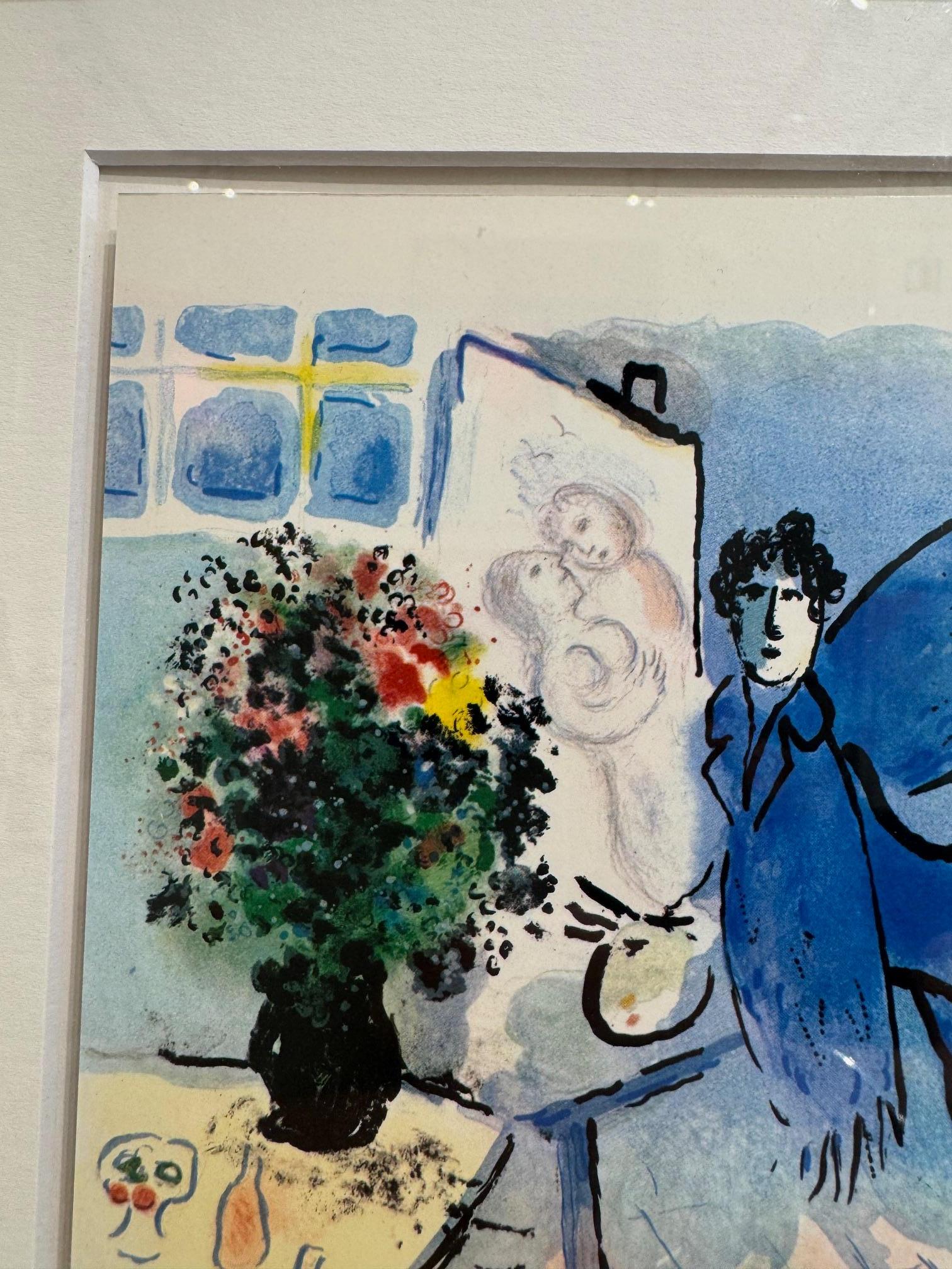 Le Atelier Bleu  - Chagall color lithograph of his studio blue angel and bouquet - Gray Figurative Print by Marc Chagall
