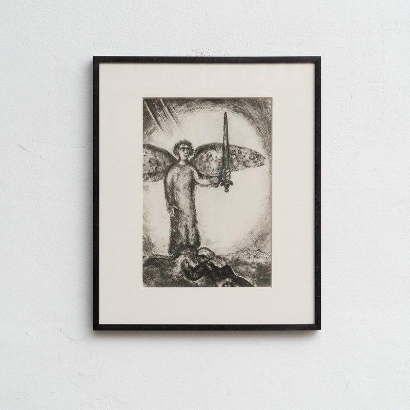 Discover a stunning black and white heliogravure print by the renowned Marc Chagall, capturing his unique interpretation of a biblical theme with his signature dreamlike style. 

This print is from the Verve publication series, originally featured