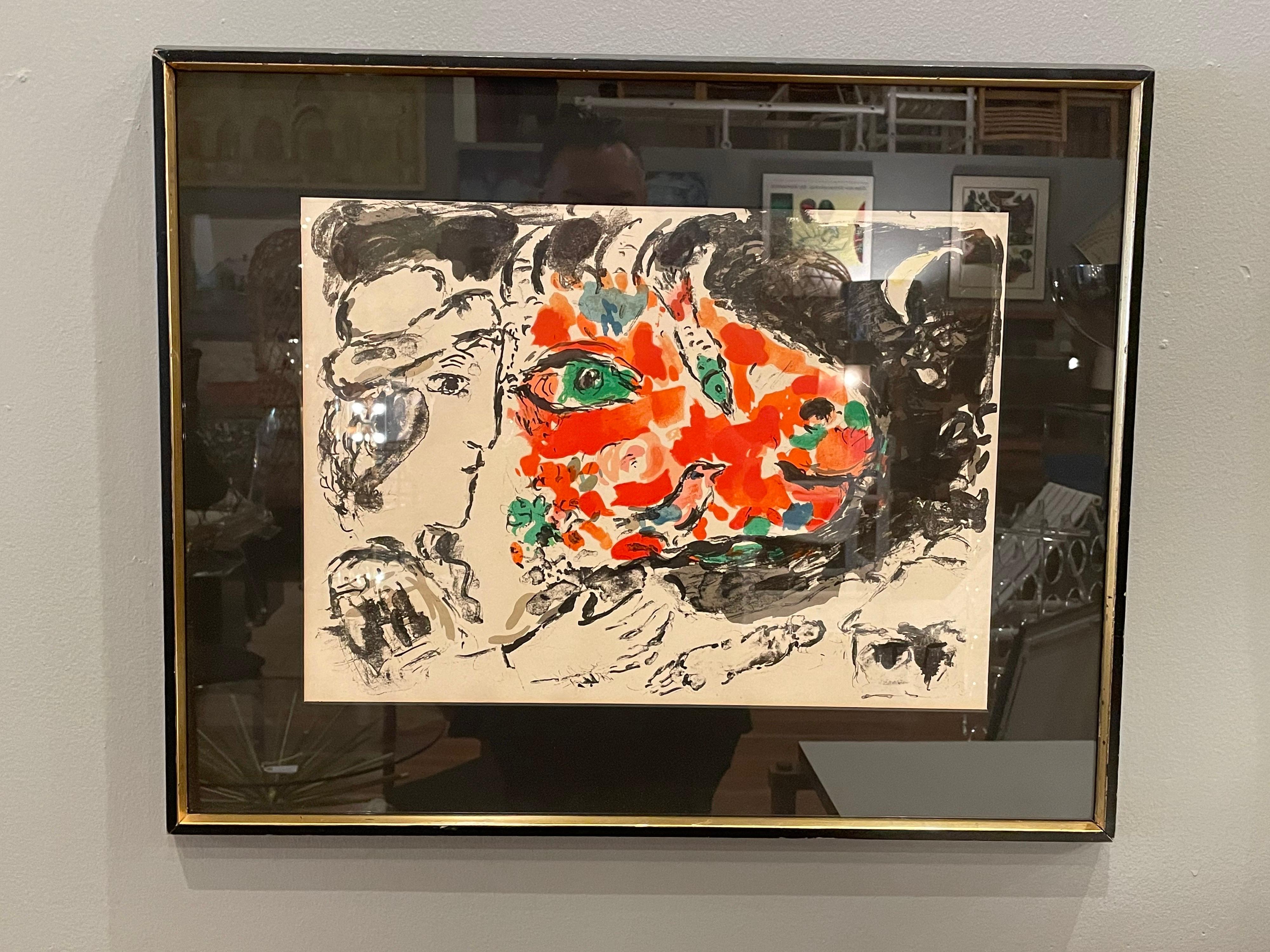 Rare framed litho by Marc Chagall, unsigned circa 1950's beautiful colors we replaced the mate and left the same frame it's in good condition with some scratches.