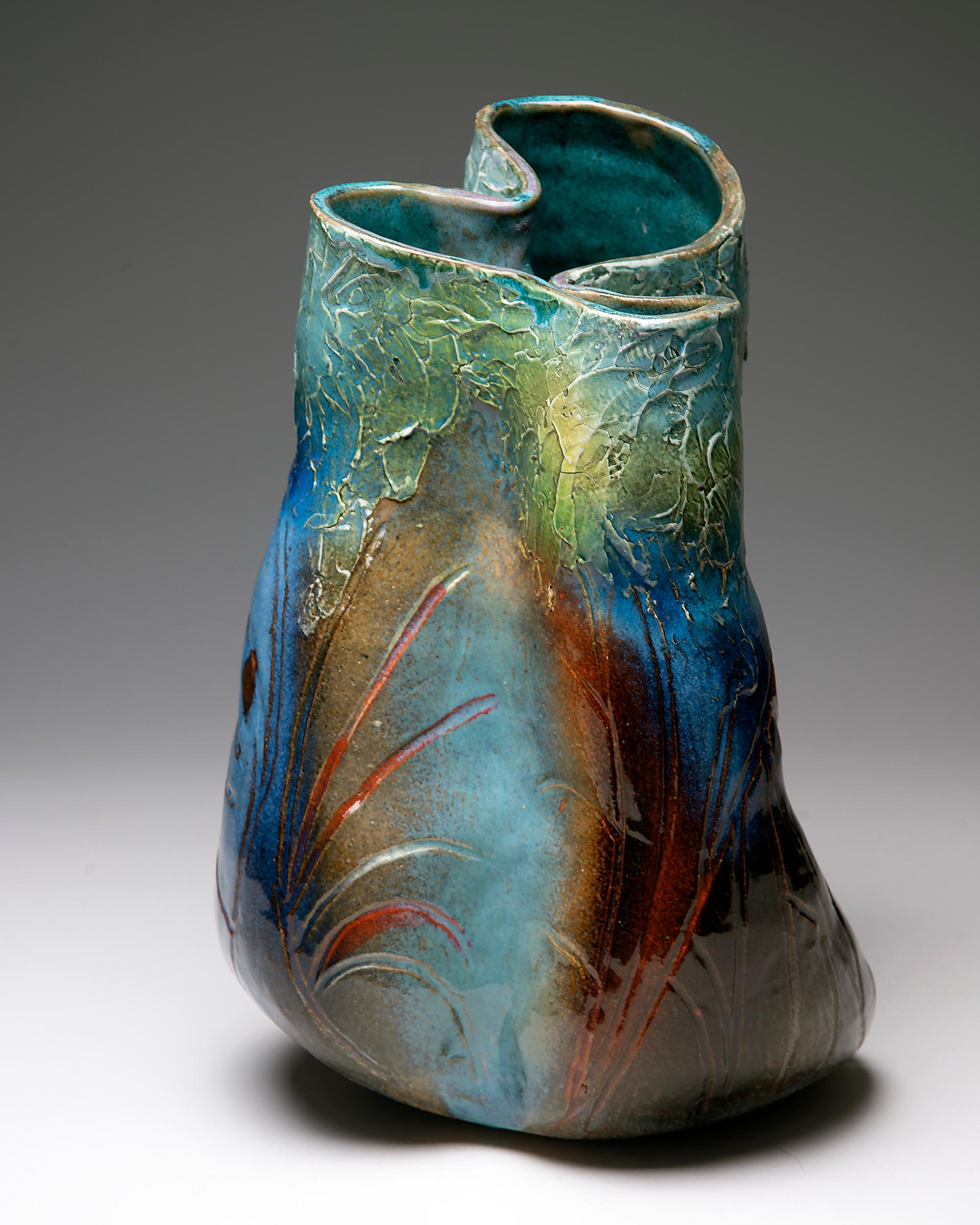 Flat coil built vessel. Organic form, allowing clay to follow its natural form
from the bottom up. Textured porcelain slip, finished with underglazes and
multiple sprayed glazes.

About the Artist Marc Cohen
I love the raw and earthy properties of