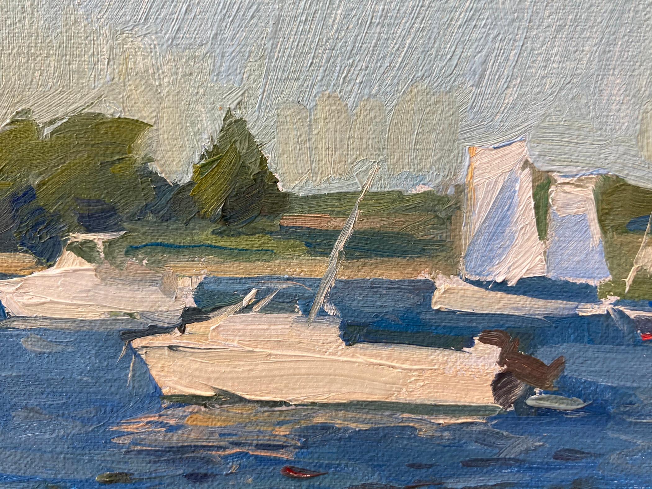 This plein air painting by Marc Dalessio depicts a calm summer day with boats resting in the harbor, sheltered by the strips of uninhabited land around them. The natural light is reflected by the small current in the water in the foreground of the