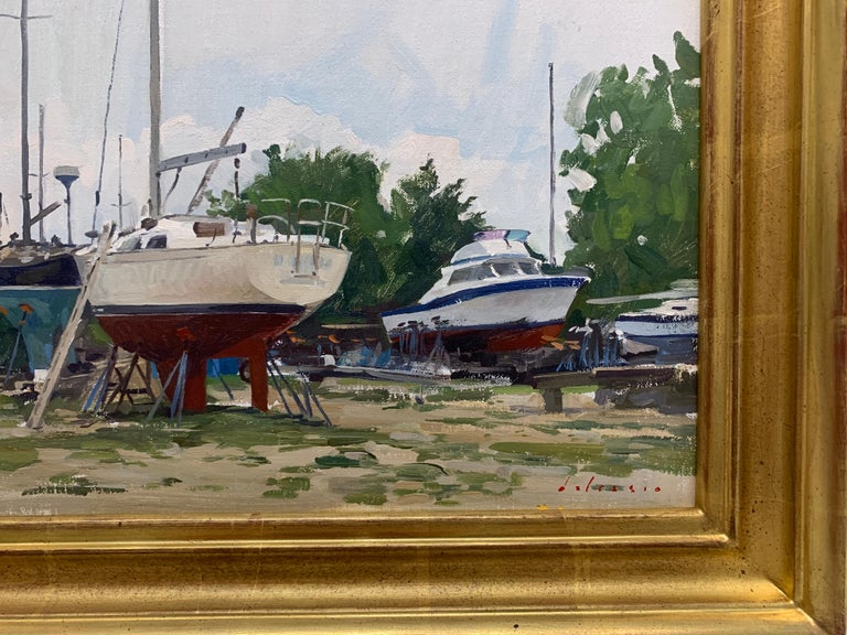An oil painting, painted en plein air at the marina on Three Mile Harbor, in The Springs, East Hampton. An overcast sky serves as the backdrop for sailboats at rest. A grassy patched first ground serves as the foreground. 

Framed in a gold leaf