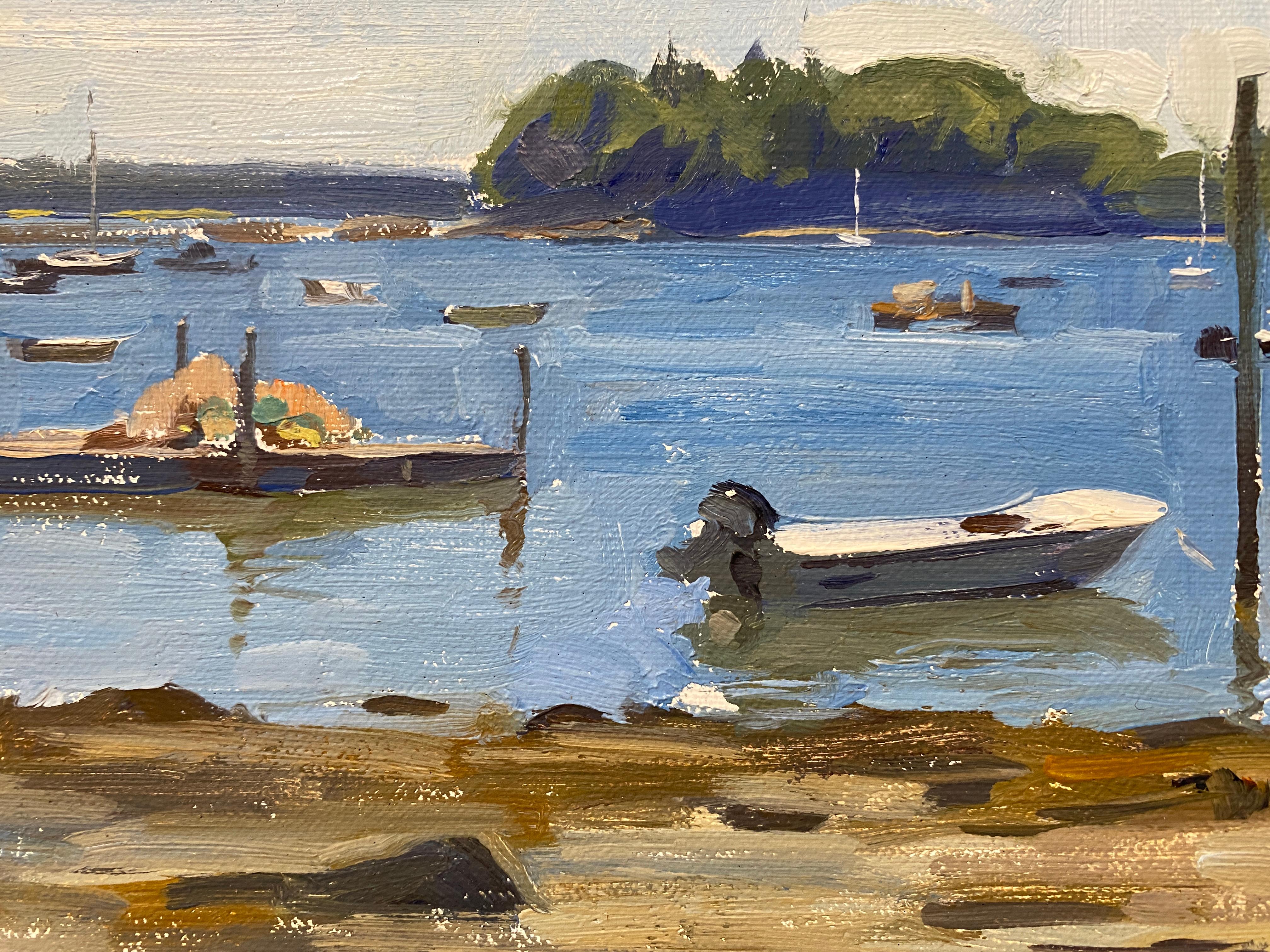 An oil painting, painted en plein air in Friendship Harbor, Maine. A classic fishing cottage rests high atop a tall wooden dock. Sandy shore foreground meets a blue body of water, speckled with boats, and rafts. The horizon meets a distant island