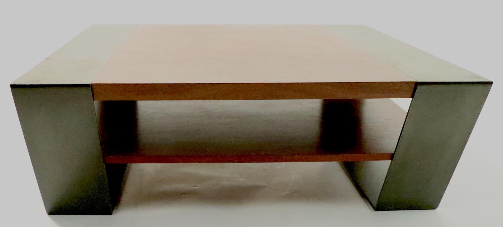 Chic architectural Postmodern contemporary coffee table of solid wood and steel construction. Very substantial, well designed and constructed, fully and correctly marked, as shown.
Original, clean condition, shows only light cosmetic wear, normal