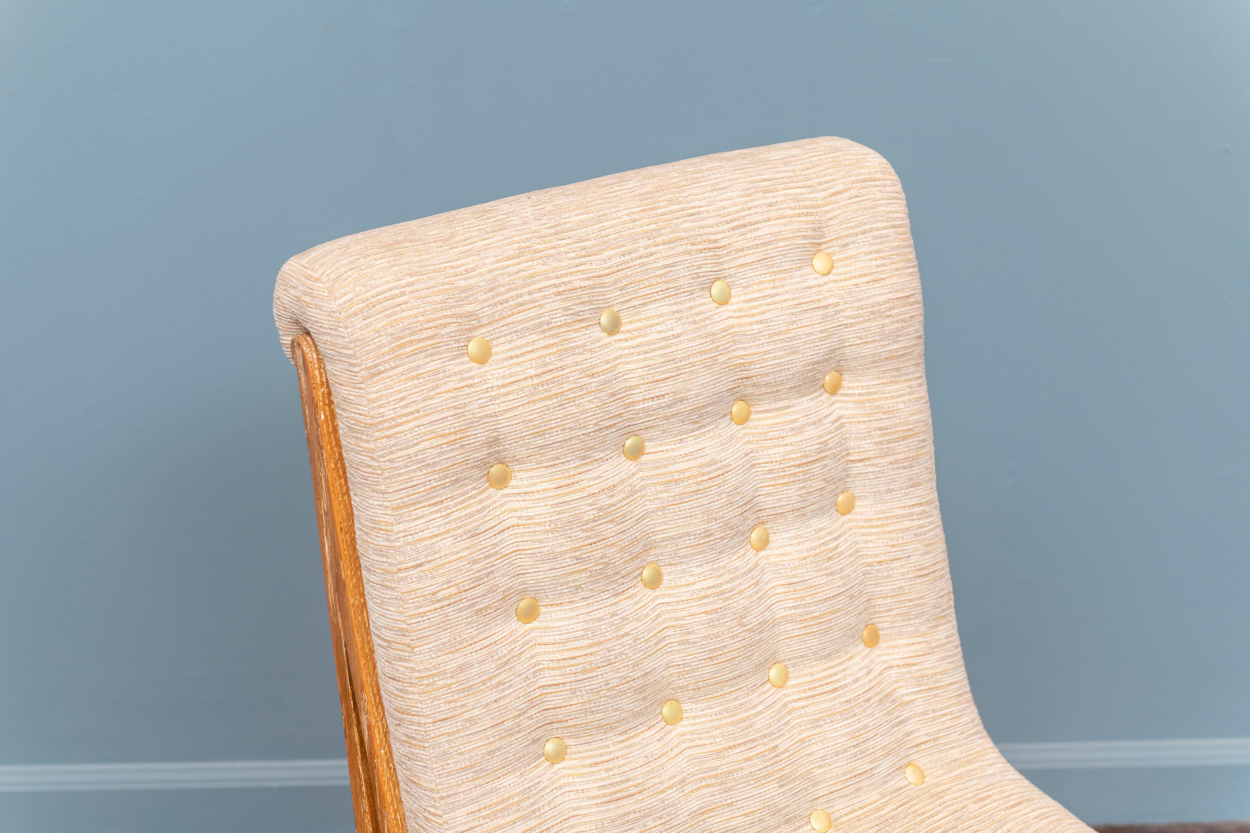 Marc du Plantier style slipper chair in limed oak with chenille fabric and gold buttons.