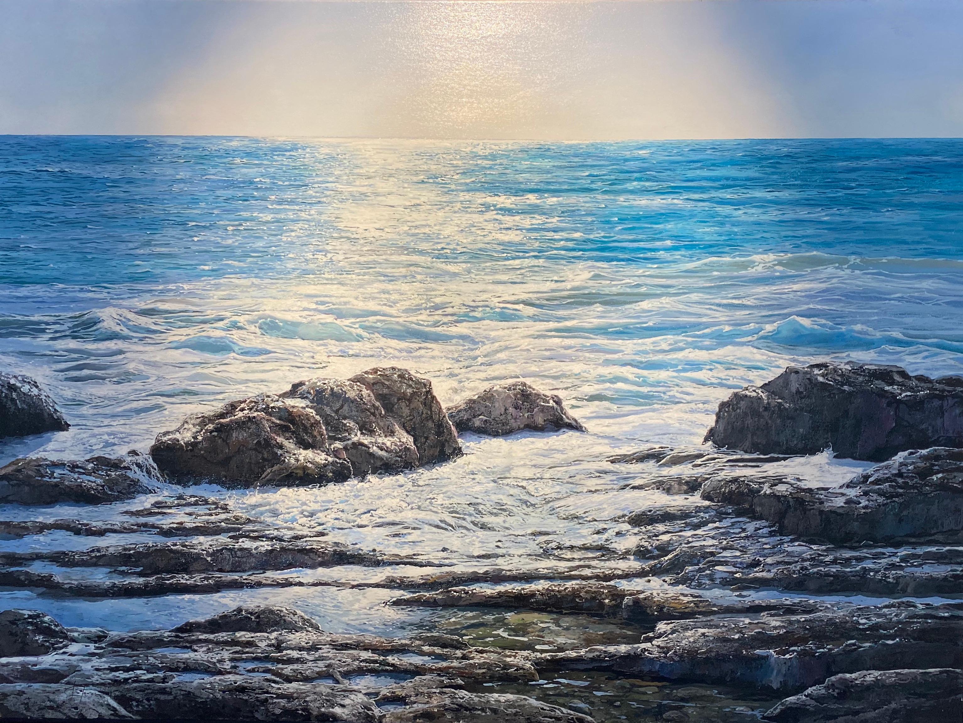'Blue Vista' Contemporary Seascape painting of rocks, blue skies, sunlit water - Painting by Marc Esteve