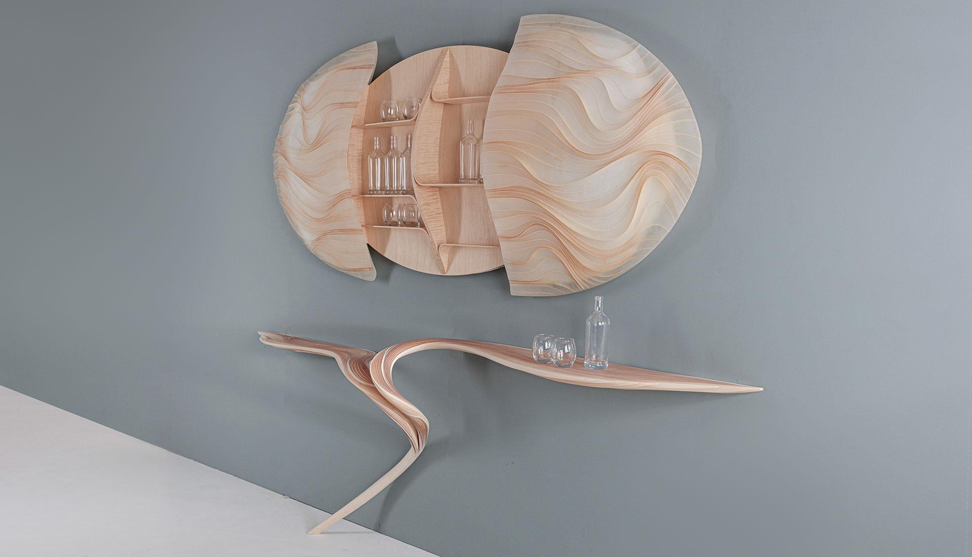 Ethereal series Drinks Cabinet and Bar by international artist Marc Fish. Made from sycamore and resin in an organic sculptural form. Elegant and sinuous the Bar has grace but also an unequivocal energy. The Drinks Cabinet is wall mounted and holds