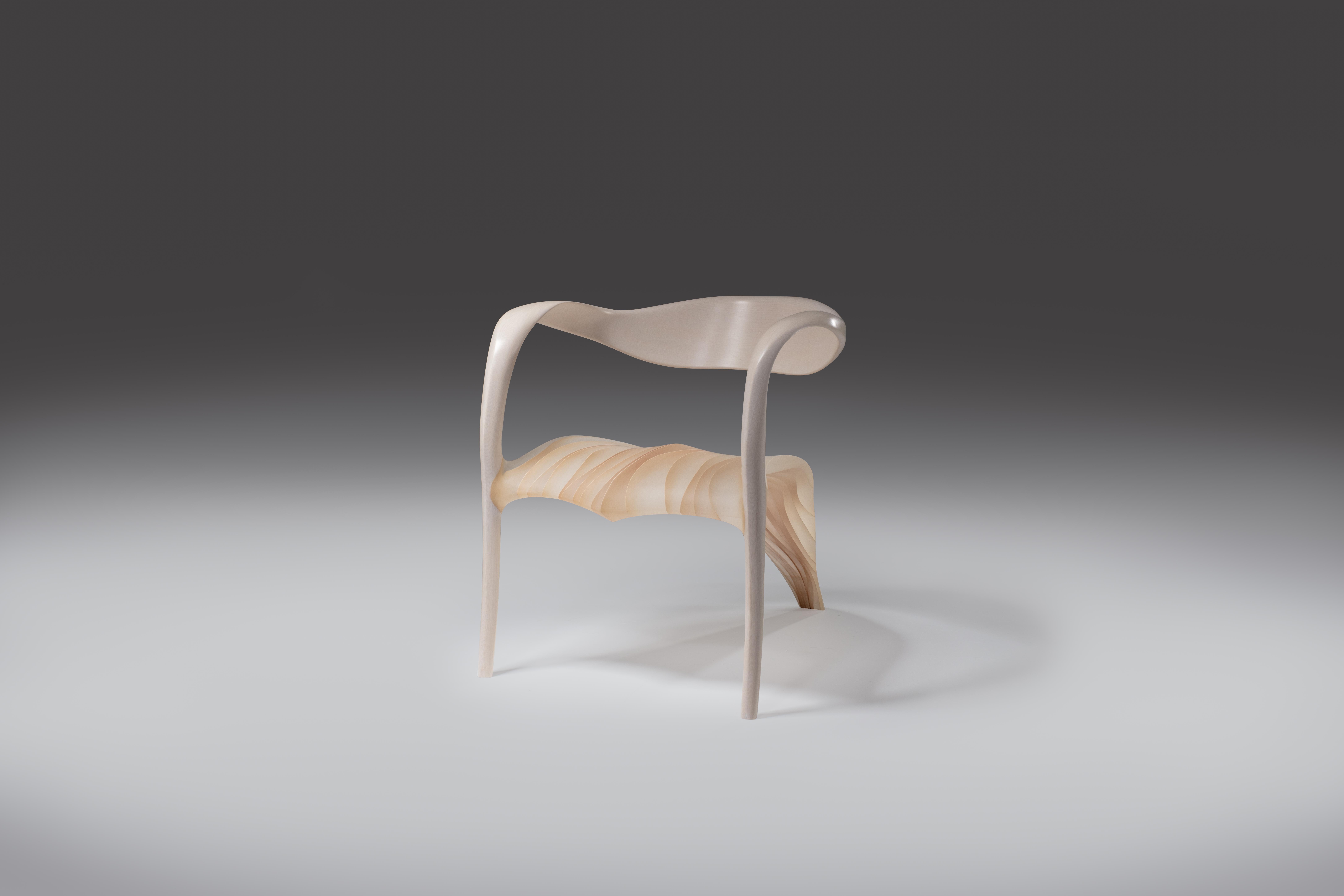 The Ethereal furniture is made from Marc Fish's usual laminated veneer technique, with the important difference that he leaves negative space between them – treating them not as layers within a solid stratigraphy, but as fins within a more open