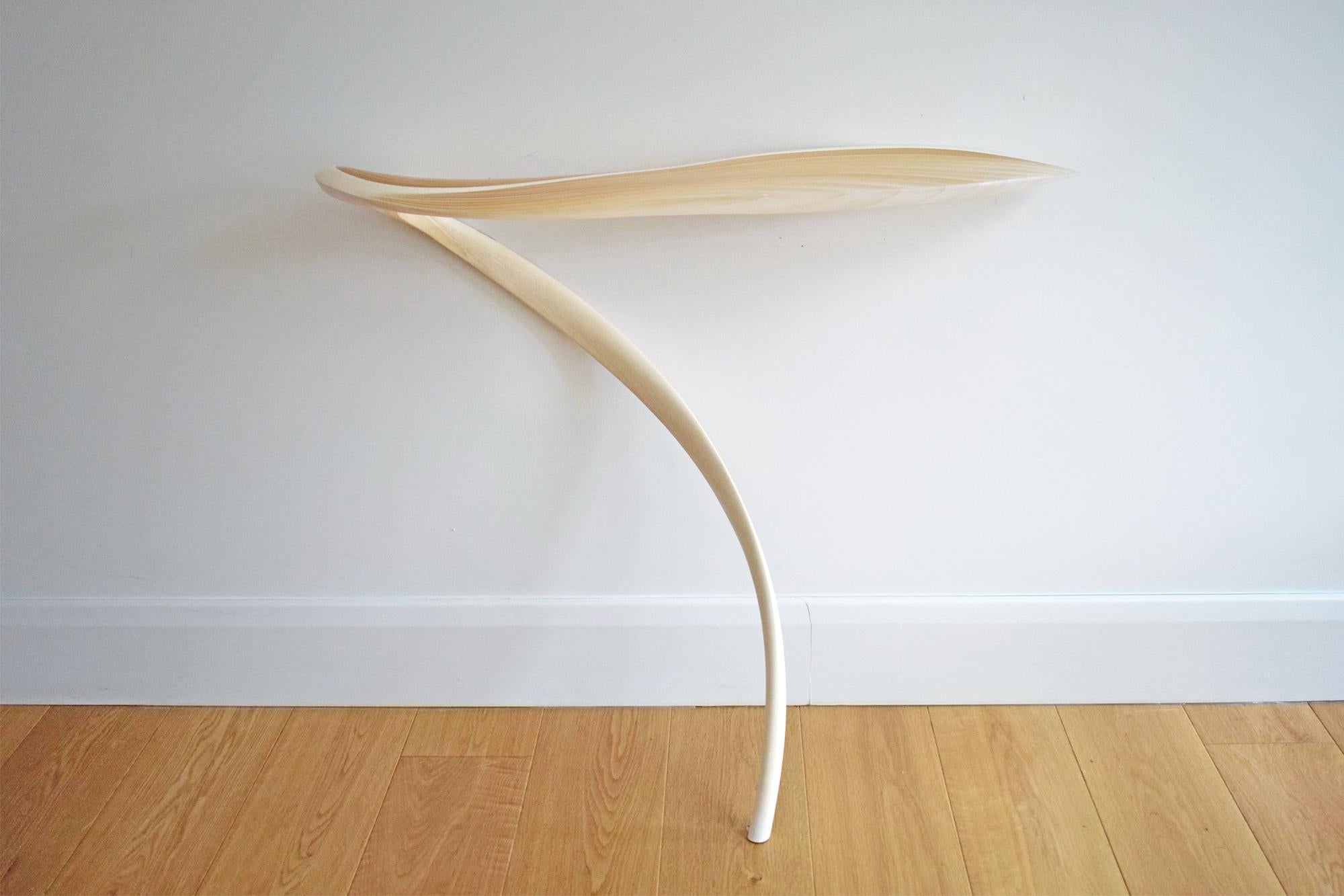 Ethereal console tables by International Artist Marc Fish. Available either right or left handed. Made from sycamore and resin in a very organic sculptural form. Elegant and sinuous the piece shows real grace but also an unequivocal energy. The