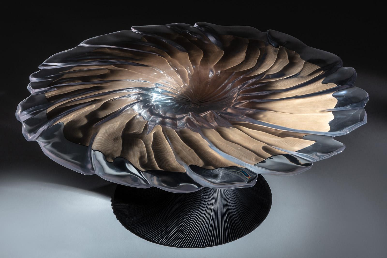 Vortex is a very special piece by Marc Fish. Hand crafted using thousands of pieces of veneer and poured resin in many stages which is then carved into to create movement and fluidity of Vortex.
The resin top is both crystal clear and has a flat