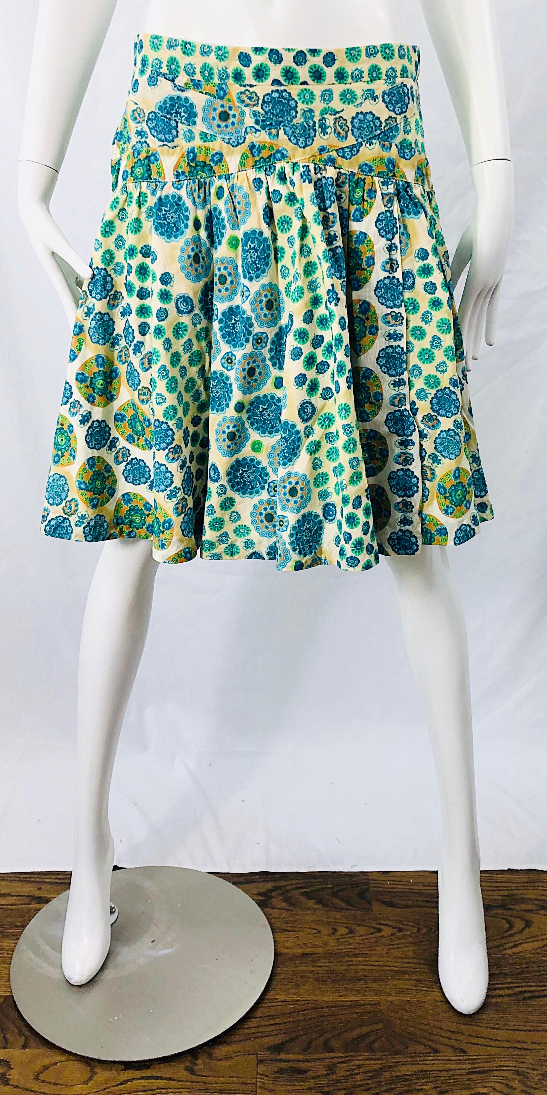 Chic early 2000s MARC JACOBS blue, green, orange, ivory and yellow low rise cotton skirt ! Features an abstract flower and polka dot print throughout. Hidden zipper up the side with hook-and-eye closure.
In great condition
Marked Size 2, but will
