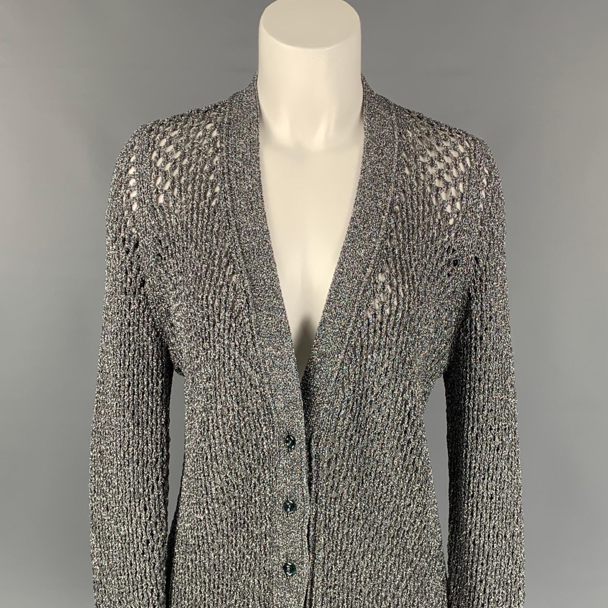 MARC JACOBS 2018 cardigan comes in a silver metallic knitted nylon, front pockets, and a buttoned closure. Made in Italy. 

Very Good Pre-Owned Condition.
Marked: M

Measurements:

Shoulder: 14.5 in.
Bust: 36 in.
Sleeve: 31 in.
Length: 33 in. 