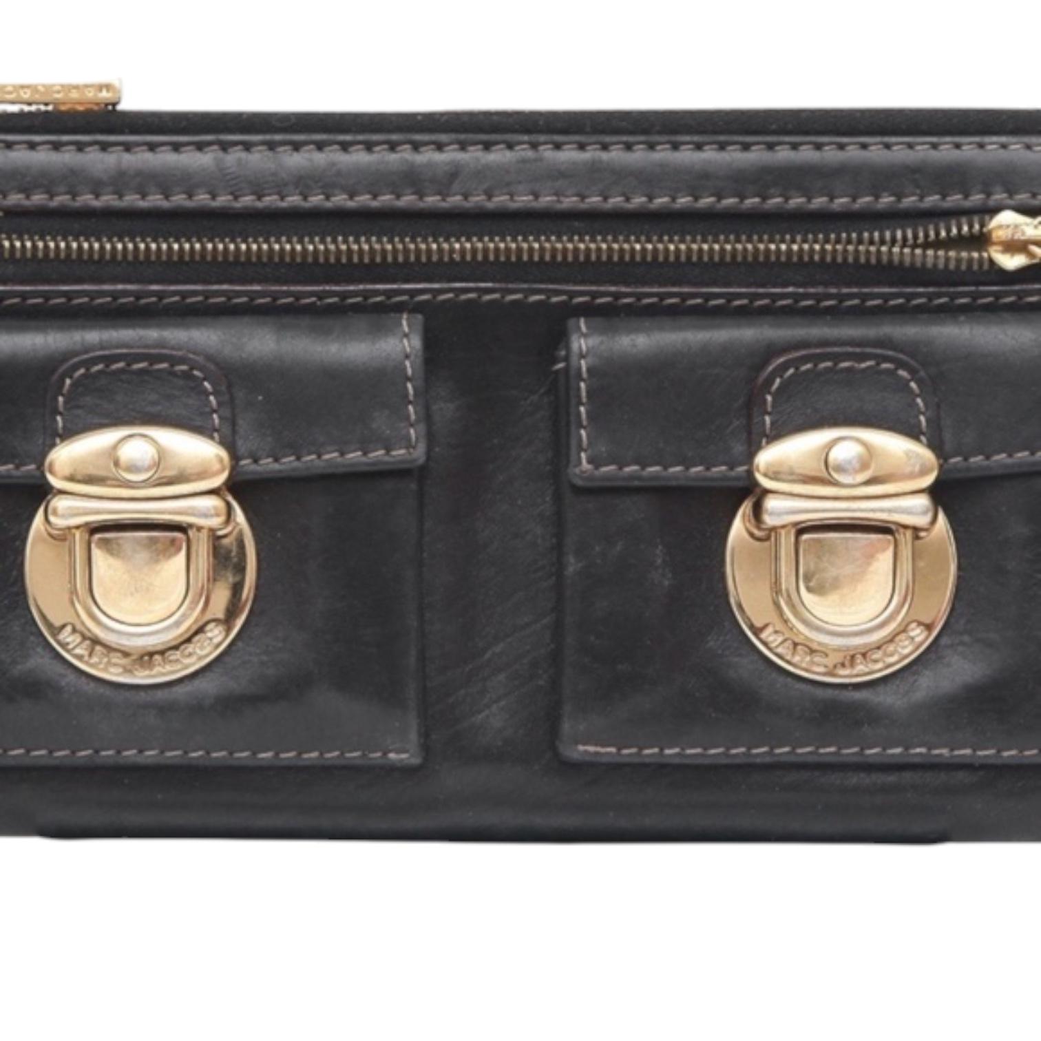 MARC JACOBS BLACK LEATHER WALLET

Details:
- Top zipper closure.
- Front zipper pocket.
- Front patch pockets, signature gold-tone hw.
- Interior holds bills & credit cards.
- Rear slip pocket.

Condition: Fair
- Wear to exterior leather,
