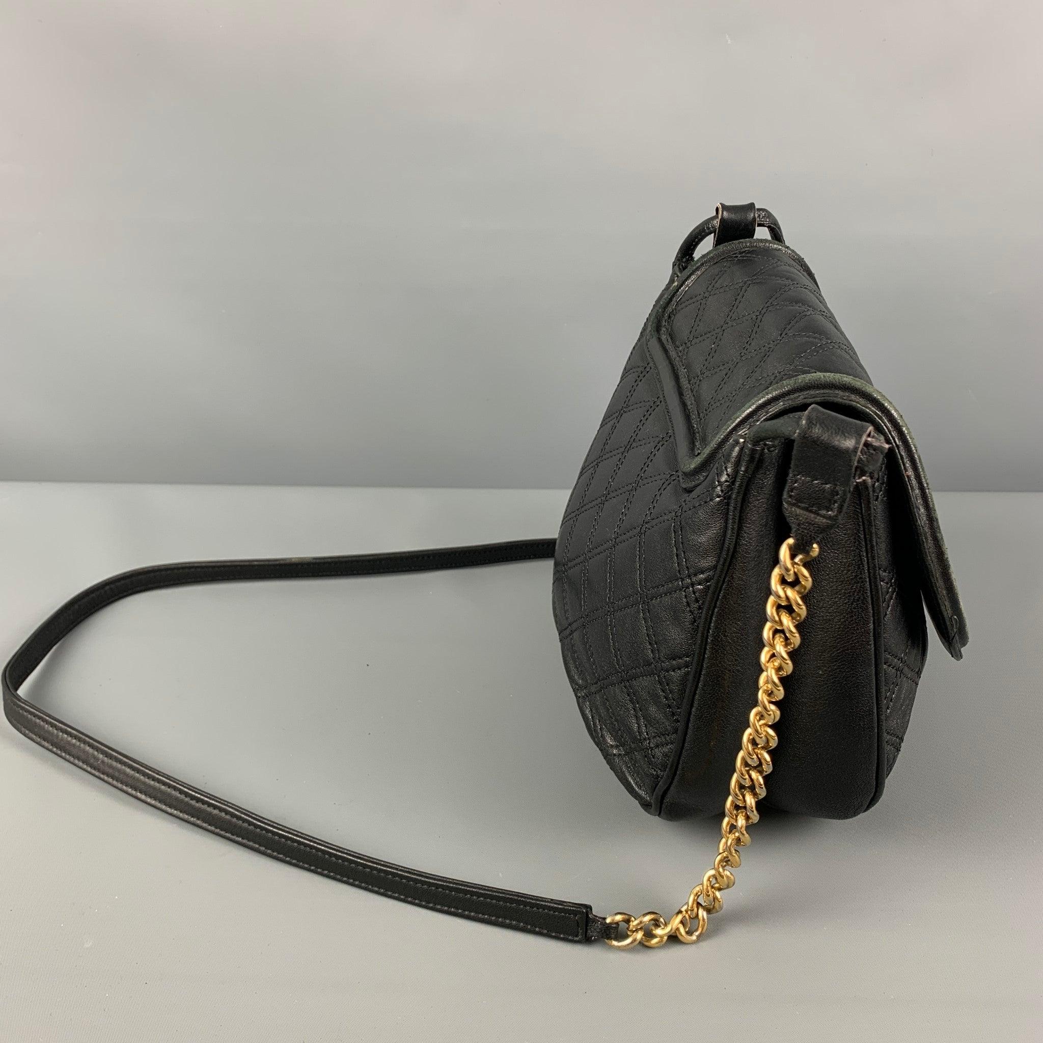 MARC JACOBS handbag comes in a black quilted leather featuring a crossbody strap, gold tone chain link trim, dual inner compartment, and a snap button closure. Made in Italy.Good Pre-Owned Condition. Light wear. As-Is.  

Measurements: 
  Length: 10
