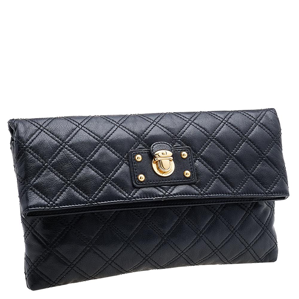 Covered in a timeless quilted pattern, this Eugenie clutch by Marc Jacobs comes in a flap style. It has a black-hued leather body with a padlock detail in gold-tone on the flap and a well-sized fabric interior. Carry this pretty clutch with your