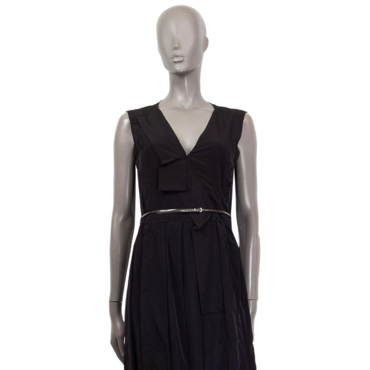 100% authentic Marc Jacobs v-neck pleated and ruched sleeveless dress in black polyester (100%). Lined in black silk (100%). Features a glitter gold-tone leather waist-belt and a slit at front. Opens with a concealed zipper on the back. Has been