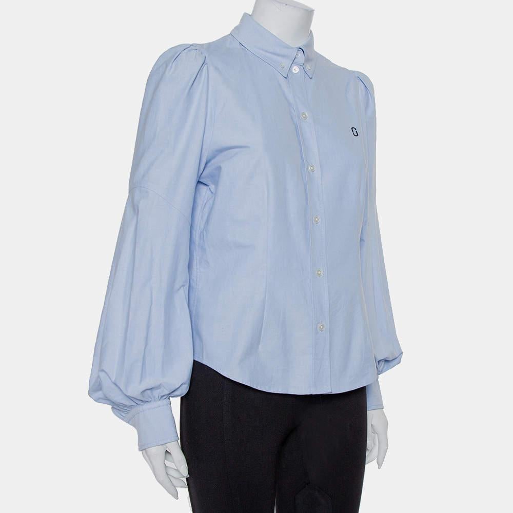 When have creations from Marc Jacobs not impressed us? They always do and this amazing shirt proves just that! The blue cotton creation has a paneled design and comes with front button fastenings and long puffed sleeves. It will look fabulous with