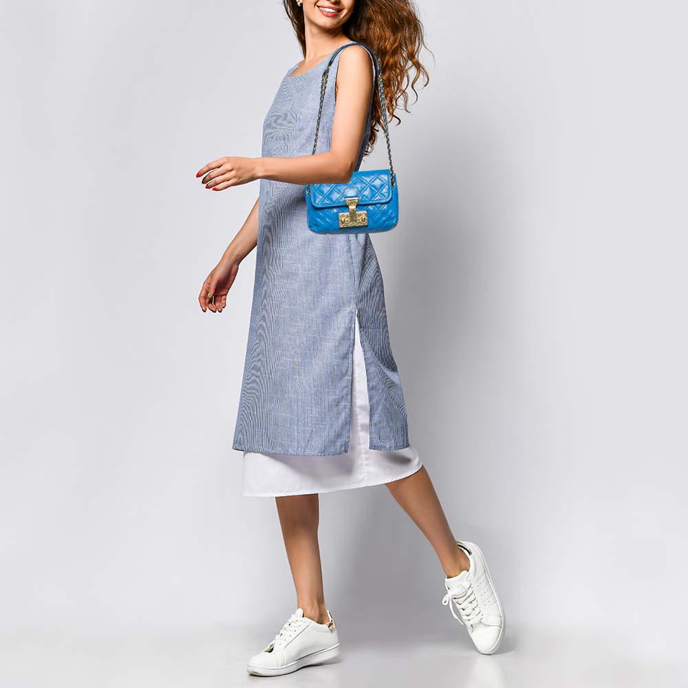 A fine mix of charm and fashion this leather bag is sure to add style to your wardrobe. The turn lock opens up to showcase a leather lined interior for your essentials. The bag is decorated with quilting and held by chains.