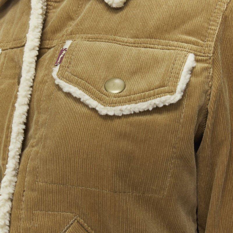 MARC JACOBS brown corduroy faux shearling lined trucker jacket XS
Reference: CELG/A00163
Brand: Marc Jacobs
Material: Cotton
Color: Brown
Pattern: Solid
Closure: Button
Extra Details: Faux shearling lined. Snap buttons.
Made in: