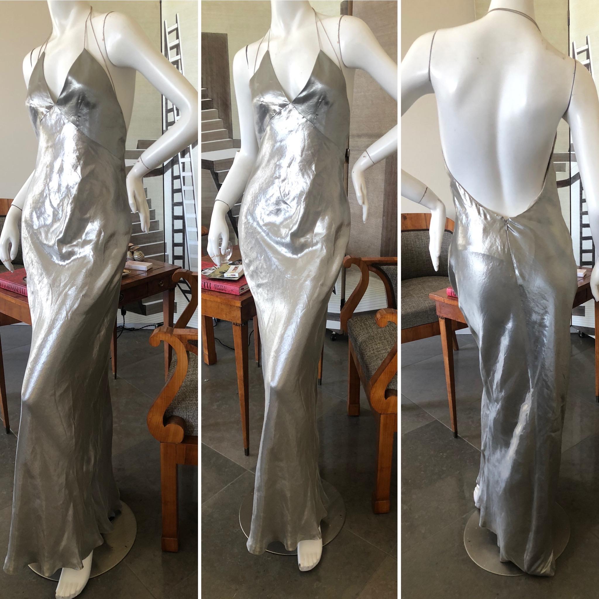 Marc Jacobs Collection Silver Silk Siren Hollywood Goddess Gown.
So pretty, the fabric is silk with metal, and is so lustrous it shimmers as you walk.
Bust 35
