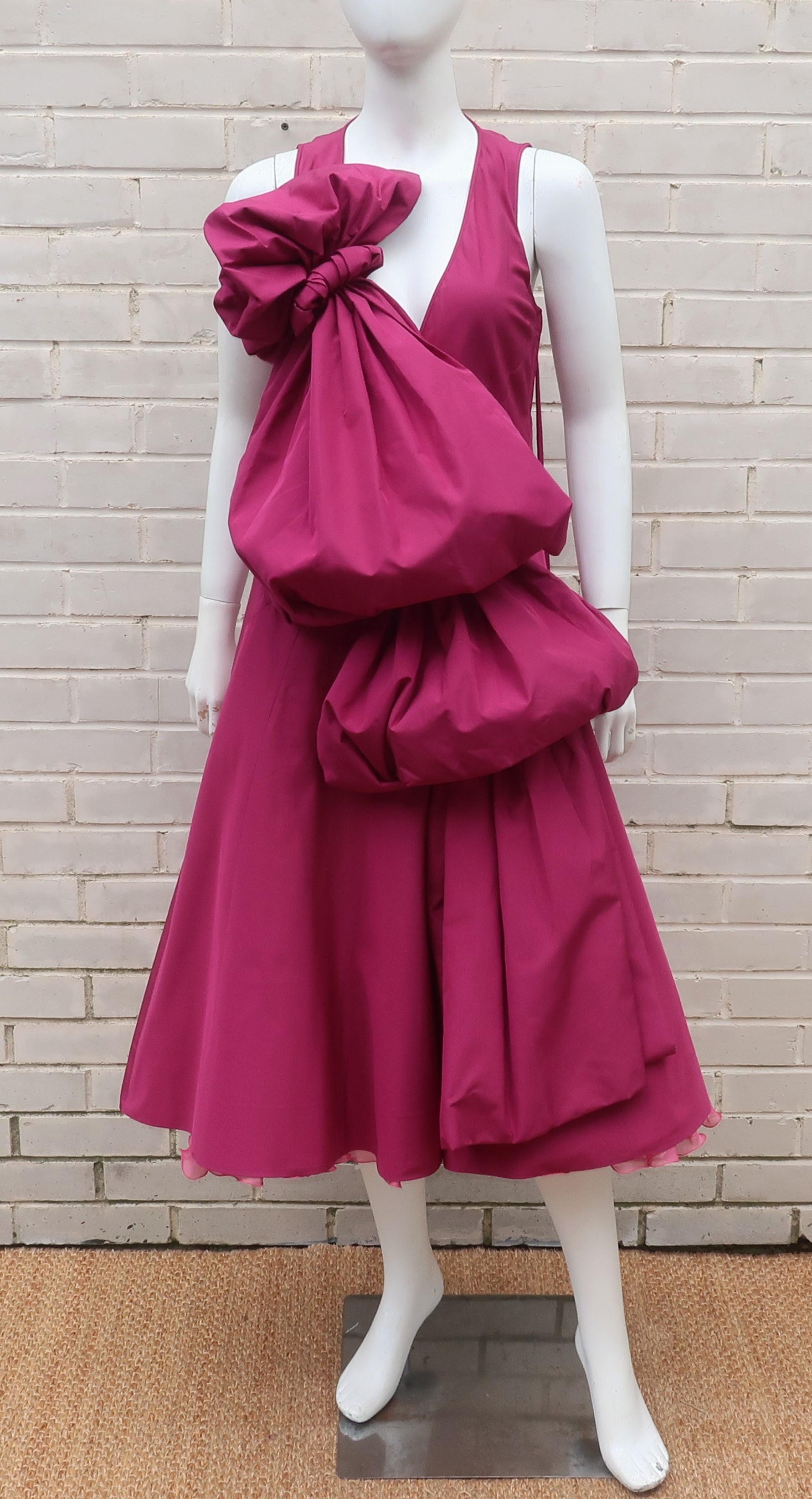 Marc Jacobs dark magenta silk taffeta dress with a built-in ruffled organza crinoline and a cascading drape with pouf.  The dress zips at the side with an exaggerated long grosgrain pull.  The front drape is shaped with hidden netting and the