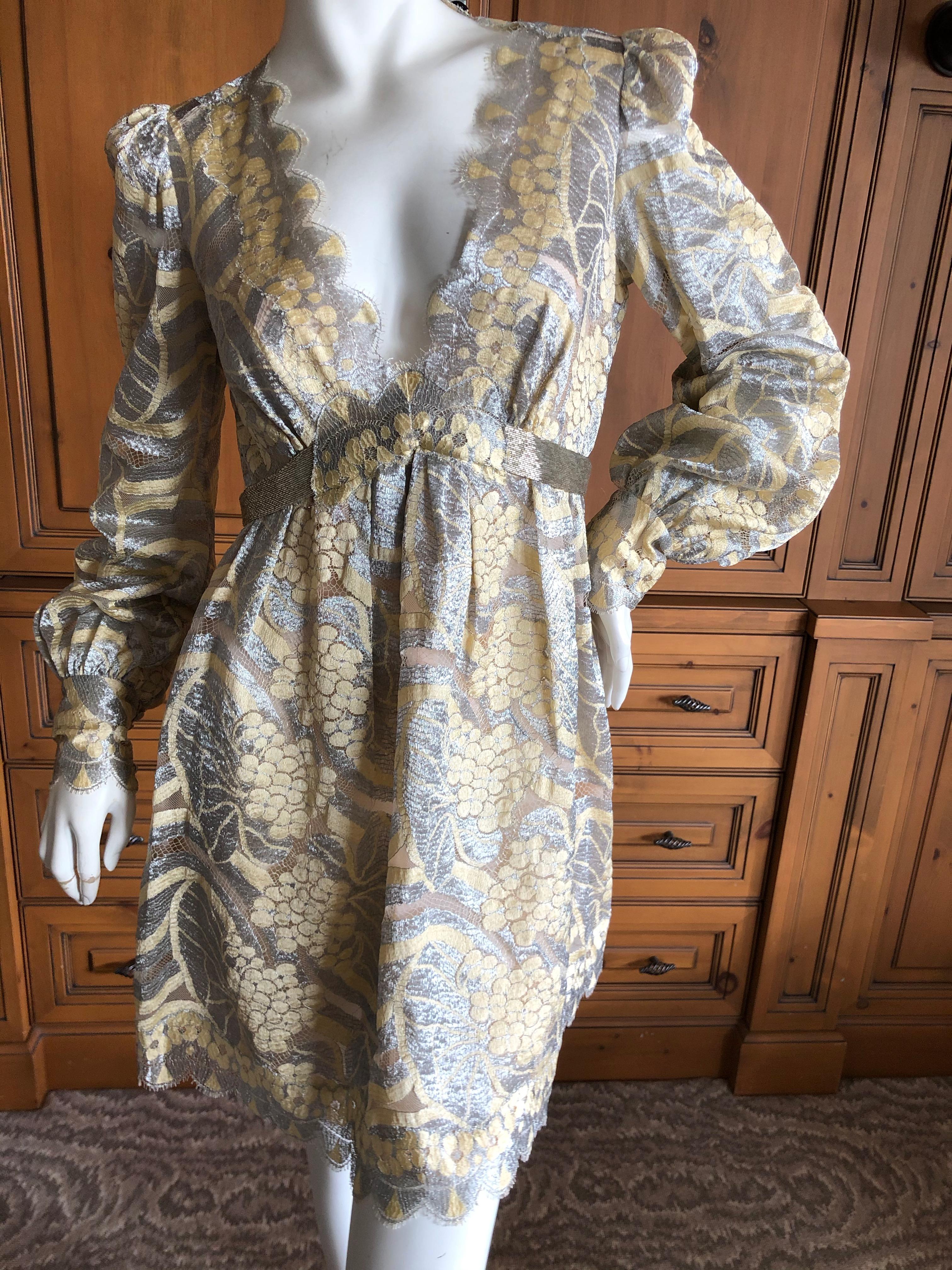 Marc Jacobs Elegant Vintage Gold & Silver Lace Scalloped Dress with Bugle Bead Belt.
Scallop lace with a low cut front and a zipper on the back.
This is so beautiful ,  reminiscent of Geoffrey Beene, the quality is superb.
Size 6
Bust 38