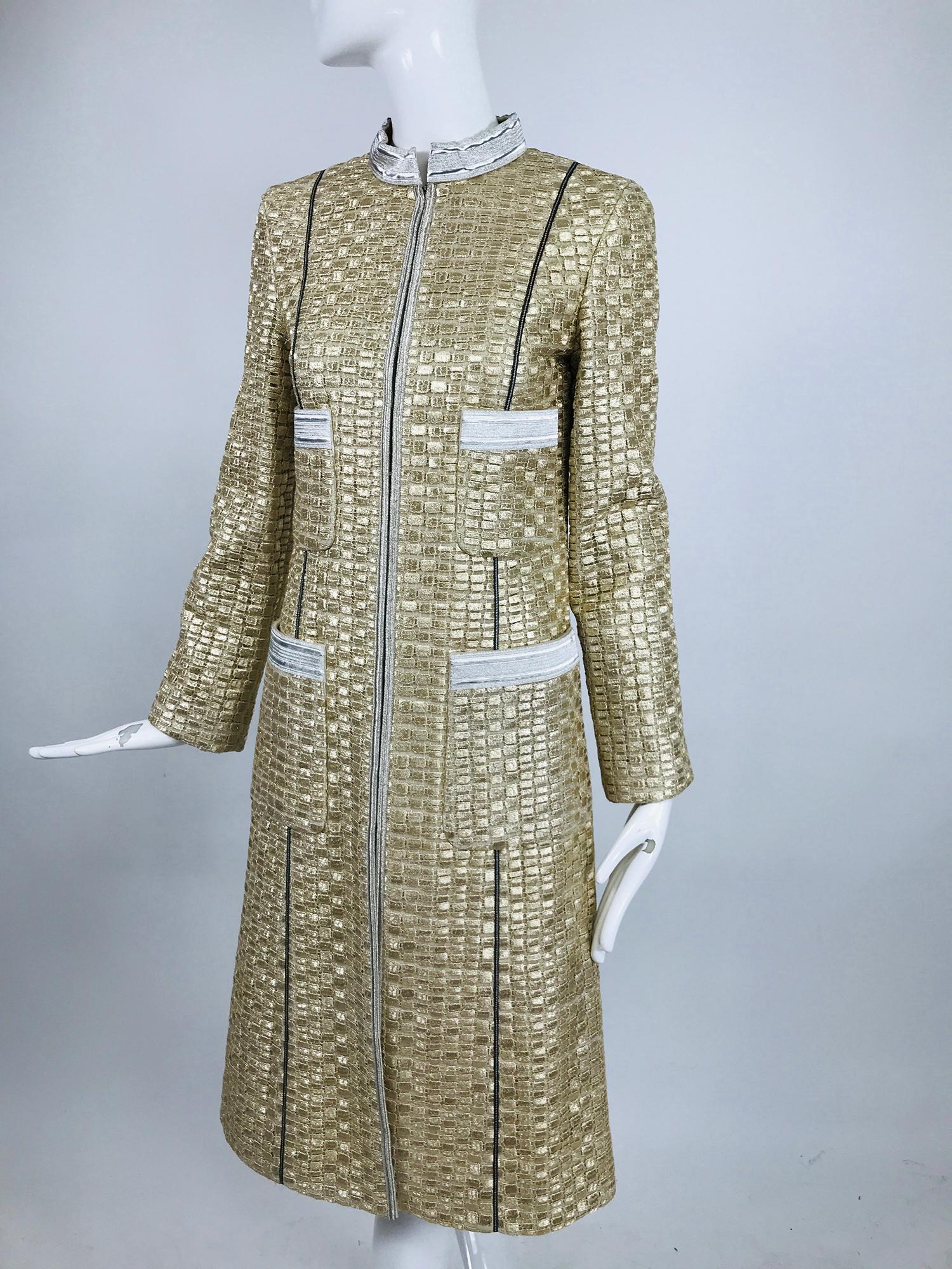 Marc Jacobs gold and silver metallic 4 pocket Chanel style coat. This is a gorgeous coat is perfect anytime, dress it up or dress it down.  Silver band collar the coat closes at the front with hidden silver hooks. The fabric is done in a grid of