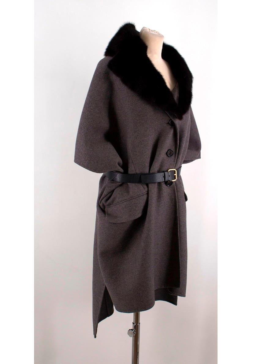 Marc Jacobs Grey Cashmere Cape Coat with Fur Collar

- Grey cape with fur collar and black leather belt
- Two illusion front pockets
-Black tone buttons
-Detachable fur collar
-Tailored around the bust
-Black elasticated belt with gold-toned