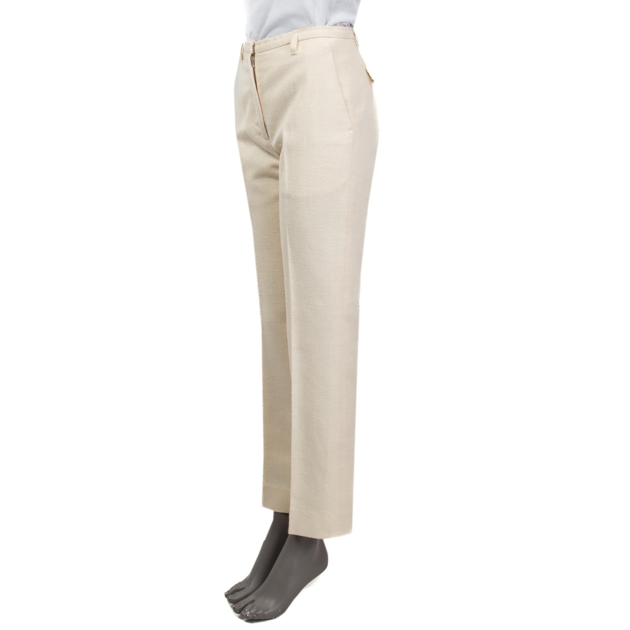 100% authentic Marc Jacobs suit pants in ivory raw silk (100%). Feature a frayed waistband and belt loops. Have two slit pockets on the front, one faux buttoned pocket and a sewn shut slit pocket at the back. Open with a concealed hook and a zipper