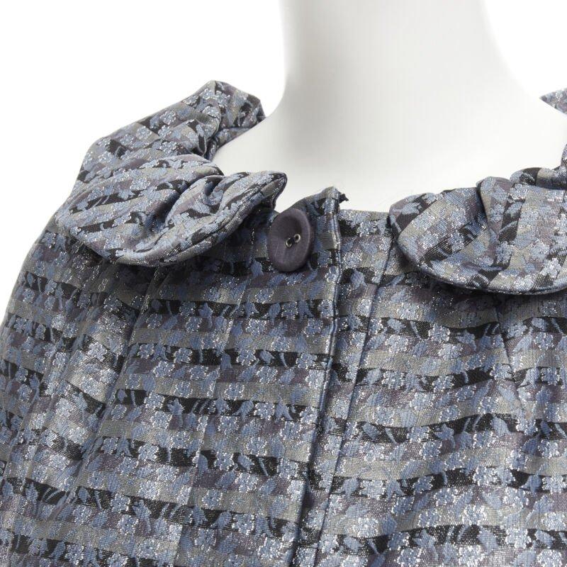 MARC JACOBS metallic blue floral jacquard belted front flared opera coat XS
Reference: CELG/A00162
Brand: Marc Jacobs
Designer: Marc Jacobs
Material: Polyester
Color: Blue
Pattern: Striped
Closure: Button
Extra Details: Ruffle peter pan collar.
