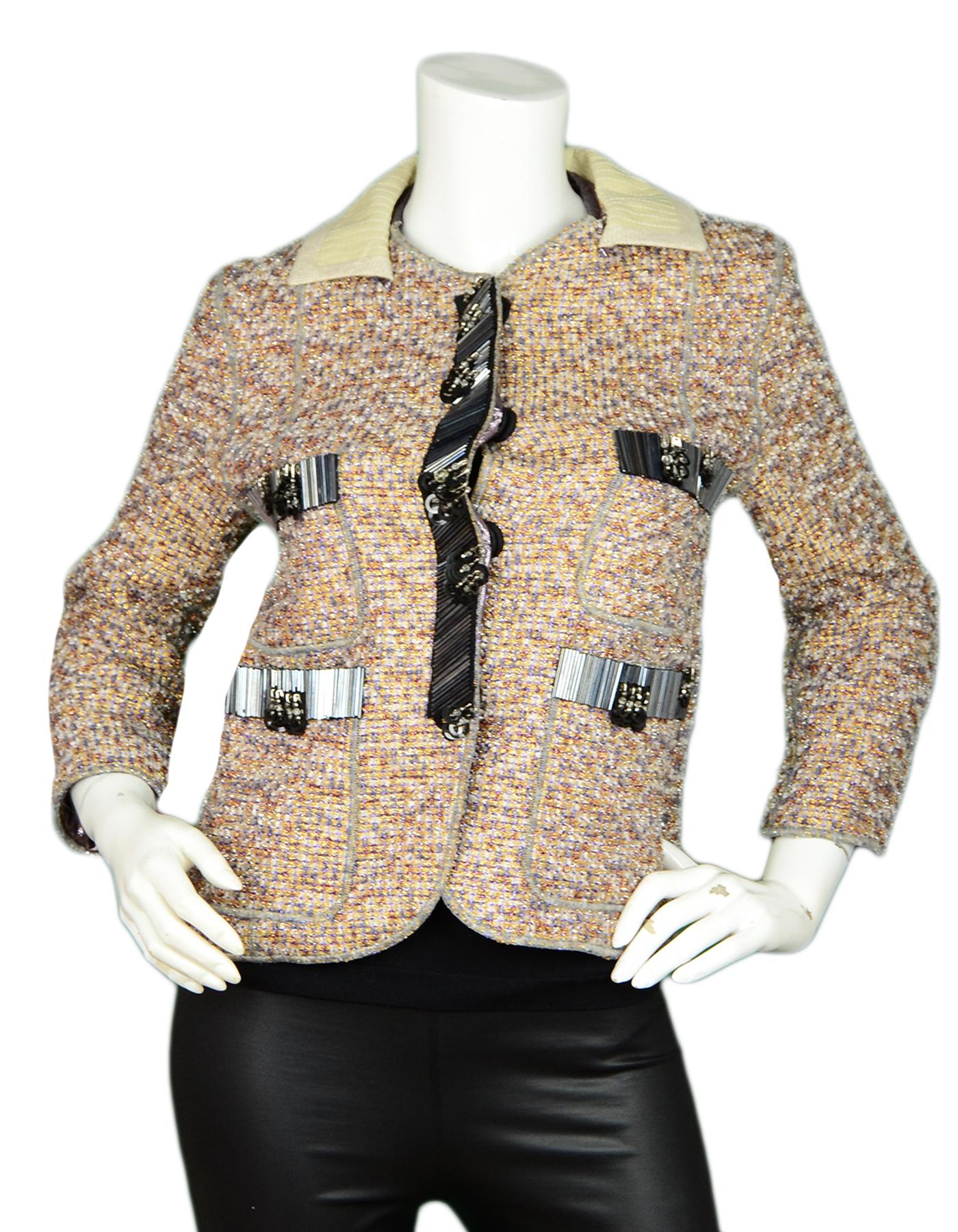 Marc Jacobs Metallic Tweed Jacket with Black Beaded Trim sz 2

Made In: USA 
Color: Multi-color
Materials: 43% Polyester, 36% Nylon, 2% Rayon
Trim: 100% Leather
Lining: 64% Silk, 36% Polyester
Opening/Closure: Front snap buttons
Overall Condition: