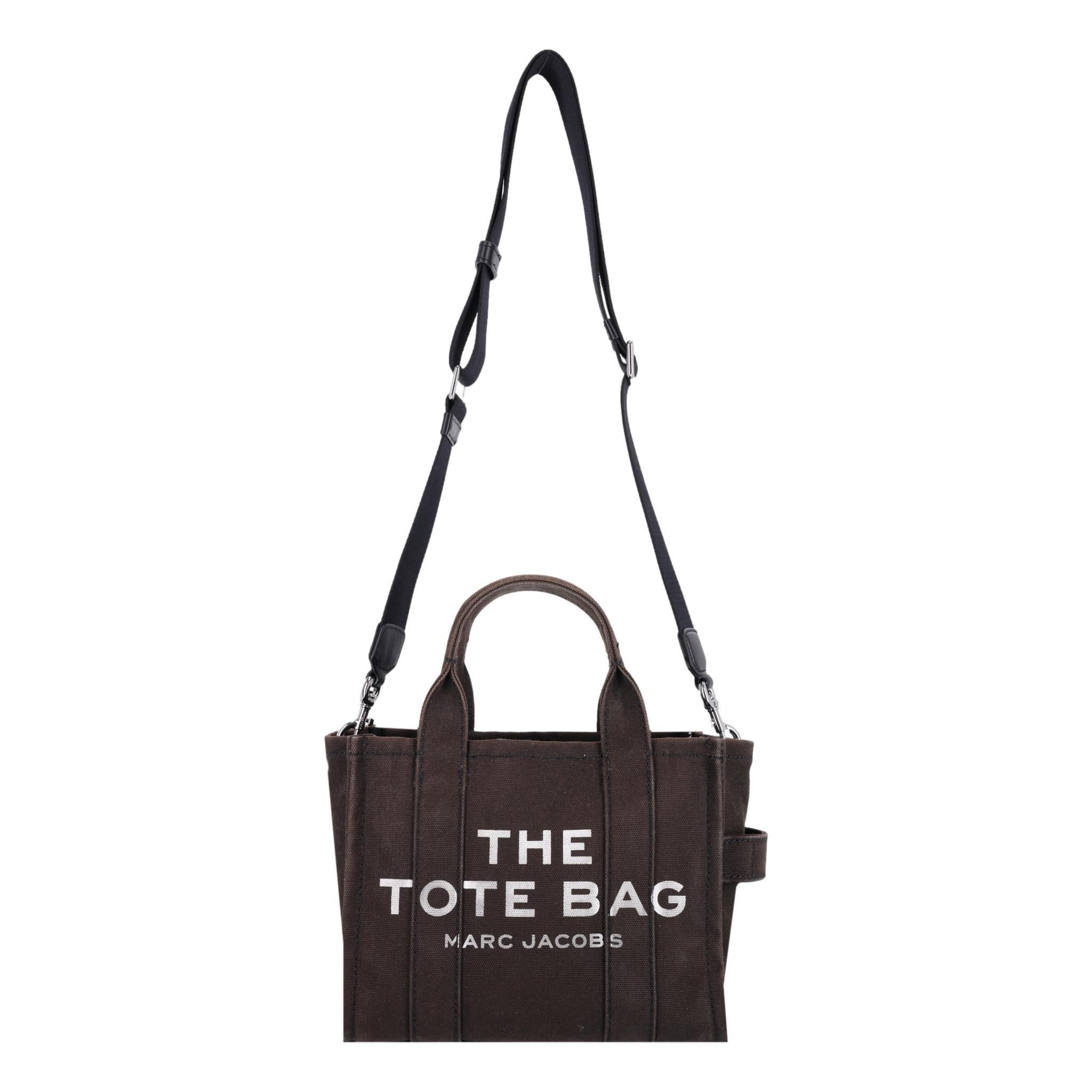 Marc Jacobs Mini Tote Bag In Canvas

Black small tote bag with top carry handles and removable crossbody strap.

Rrp £195

Size - Small Model

Condition - Good (Some lightness of colour)

Composition - Canvas

Comes With - Shoulder strap